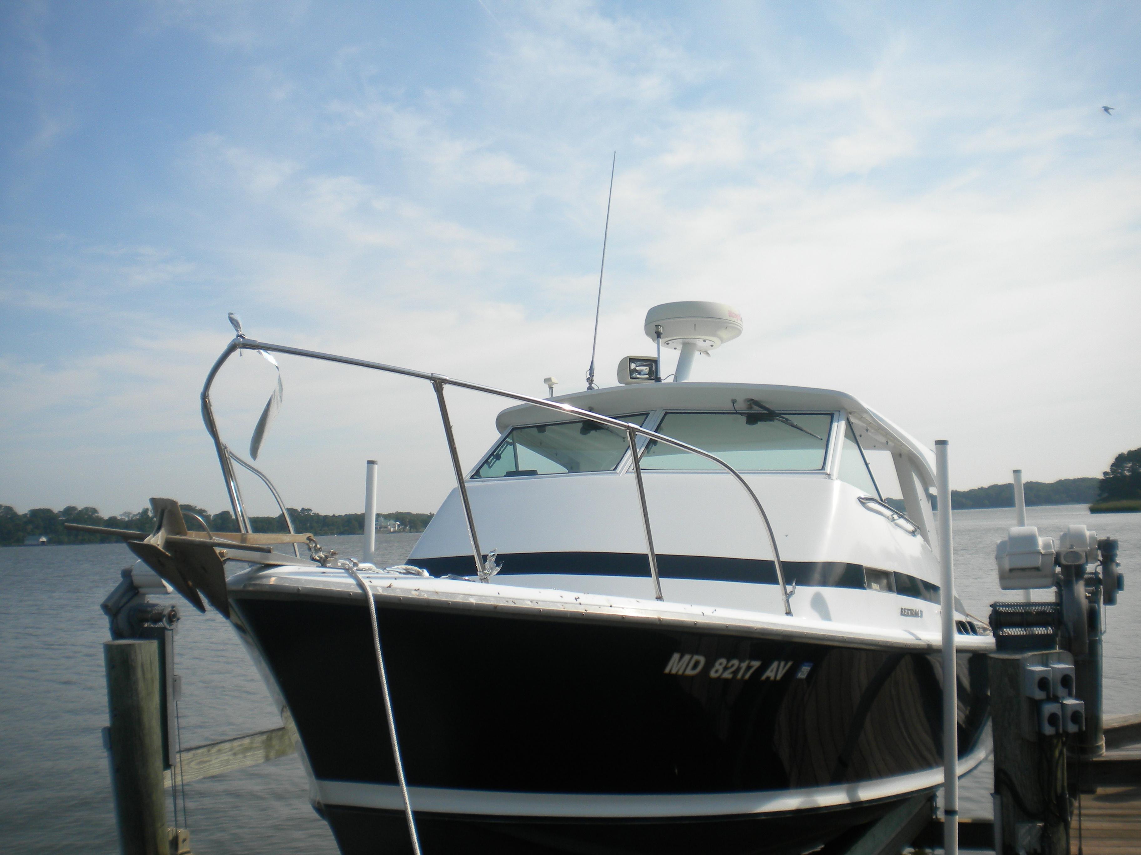 1968 Bertram 31 Bahia Mar boat docked by the water on a sunny day.