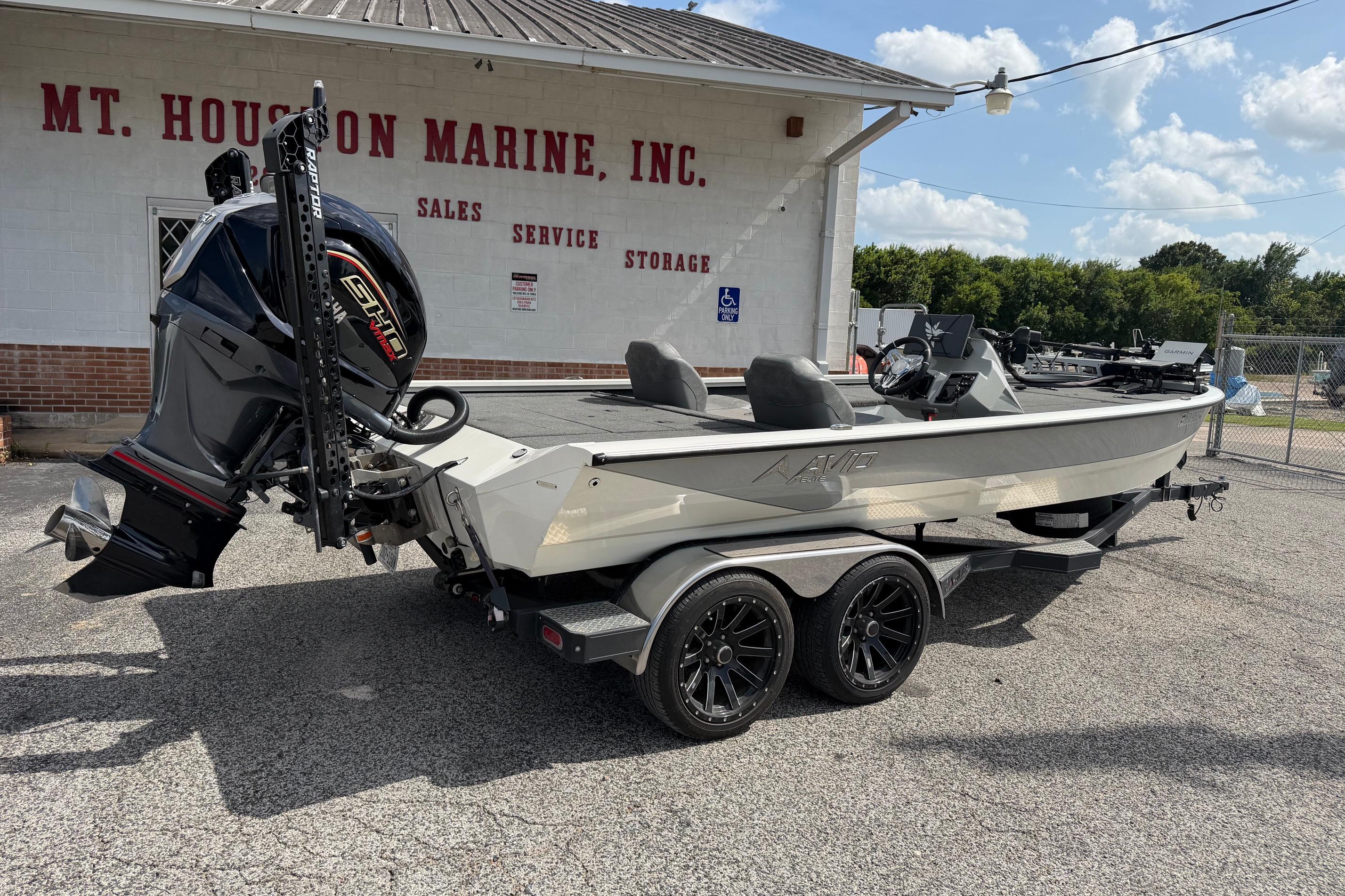 2024 Avid 21 XB Elite boat on trailer at Mt. Houston Marine dealership.