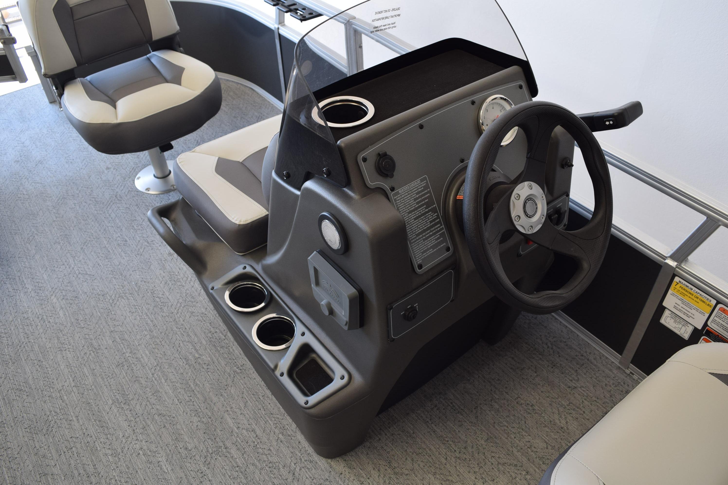 2026 Sun Tracker Bass Buggy 16 XL Select boat interior with steering console and seating.