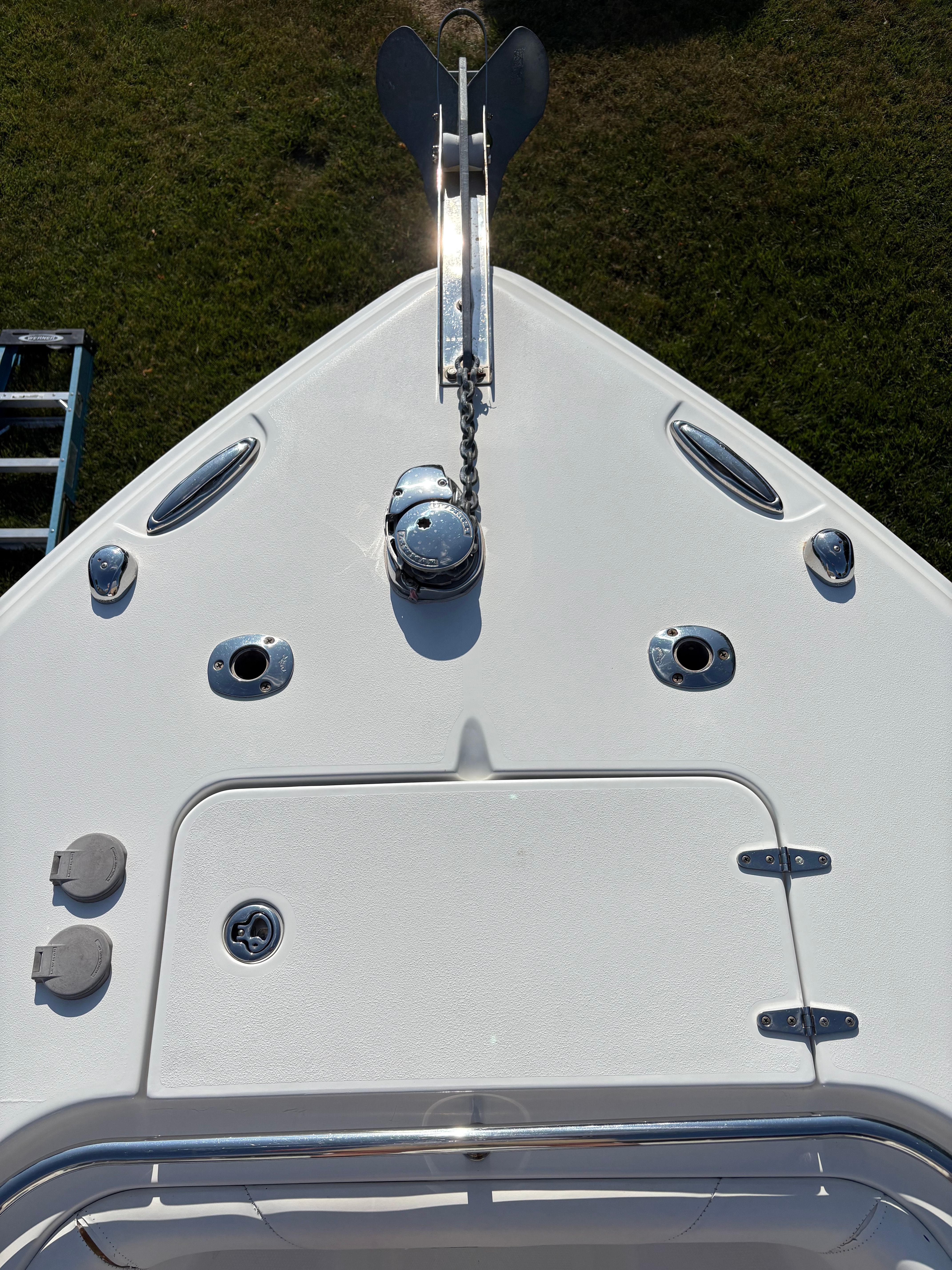 Bow of a boat with anchor and chain mechanism.