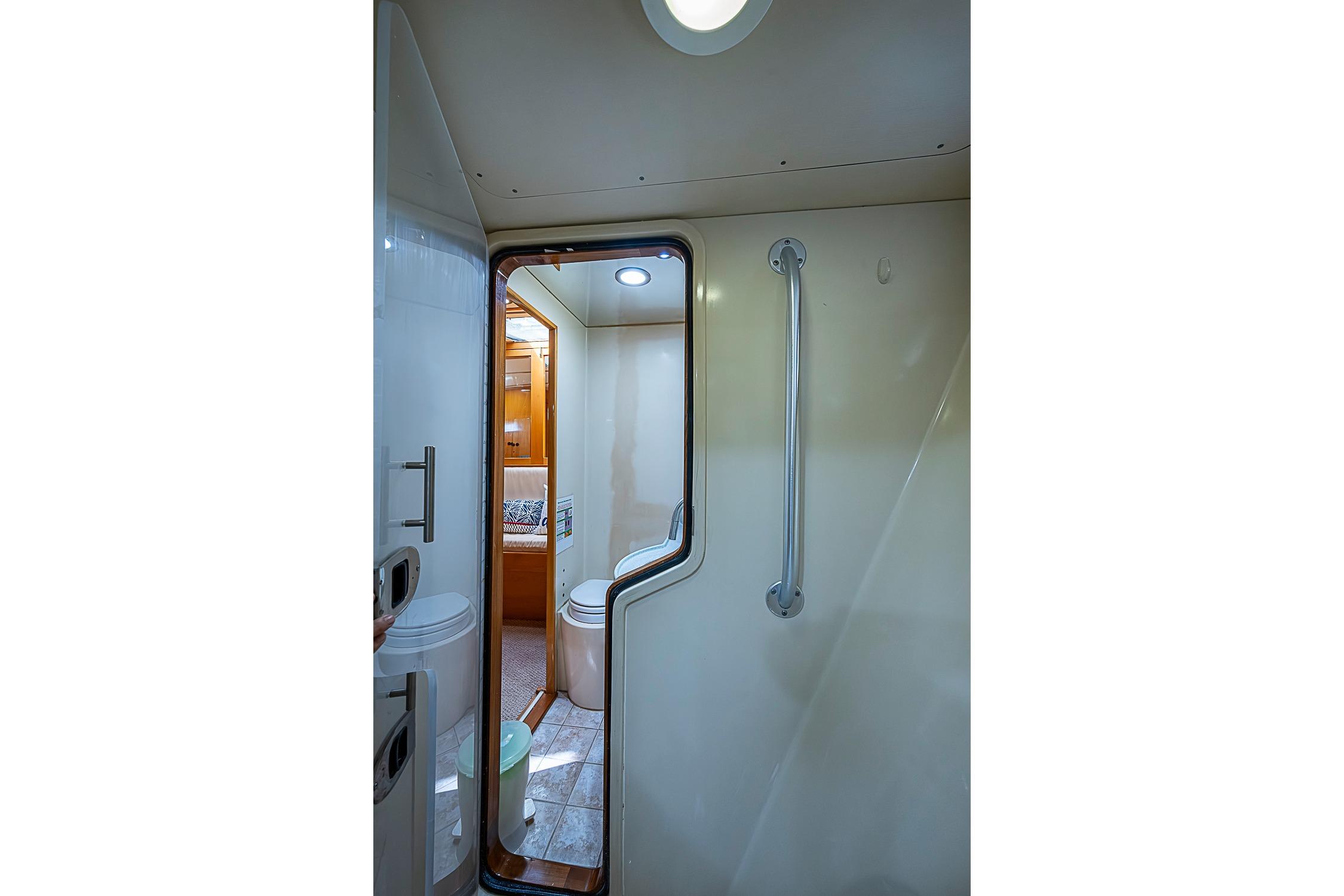 Interior view of 2003 Magna Marine Nova Scotia 47 yacht bathroom with modern fixtures.