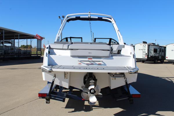 2025 Cobalt CS23 boat rear view, displayed outdoors on a sunny day.