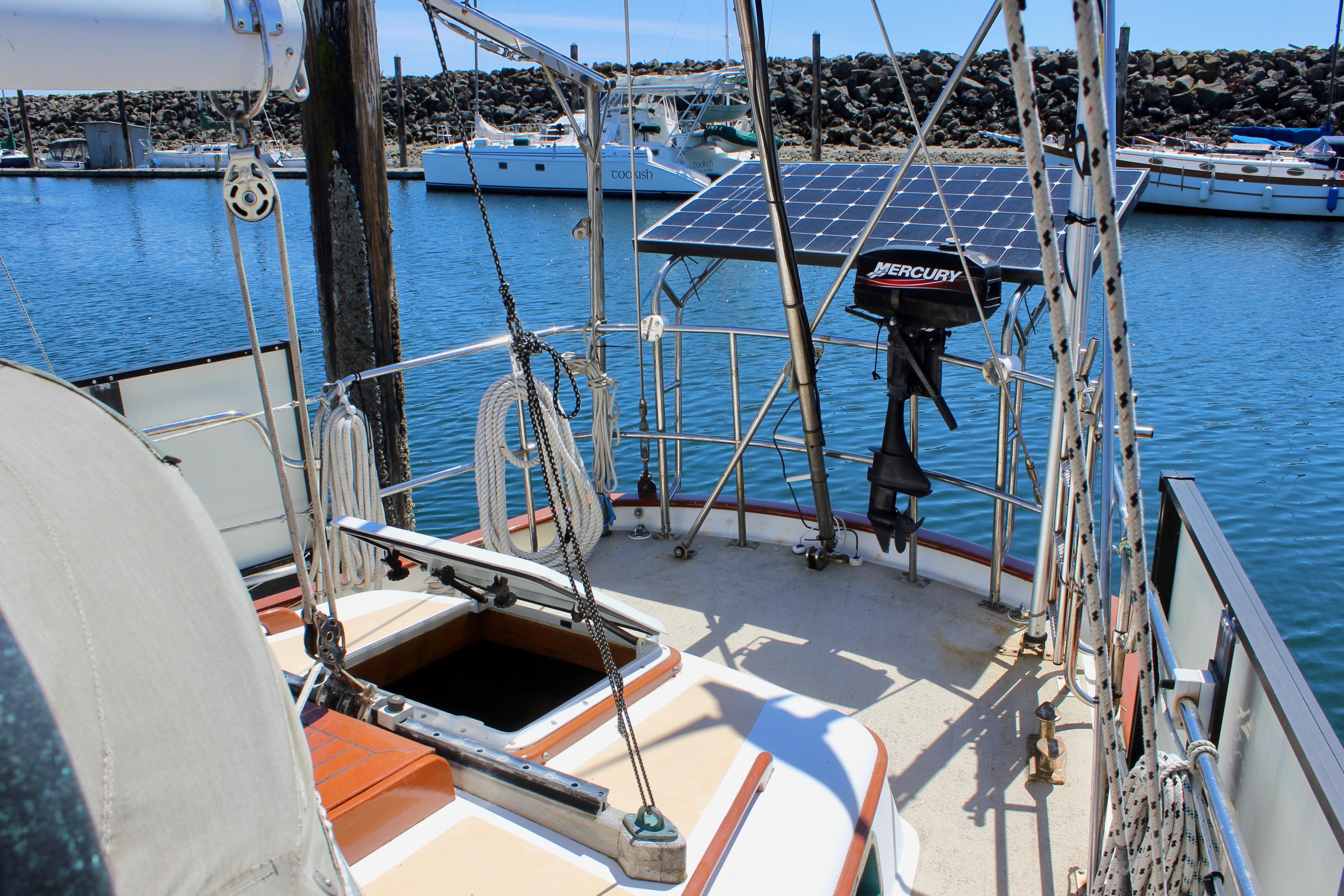 Sailboat deck with solar panel and outboard motor, Kelly Peterson 46, 1981 model.