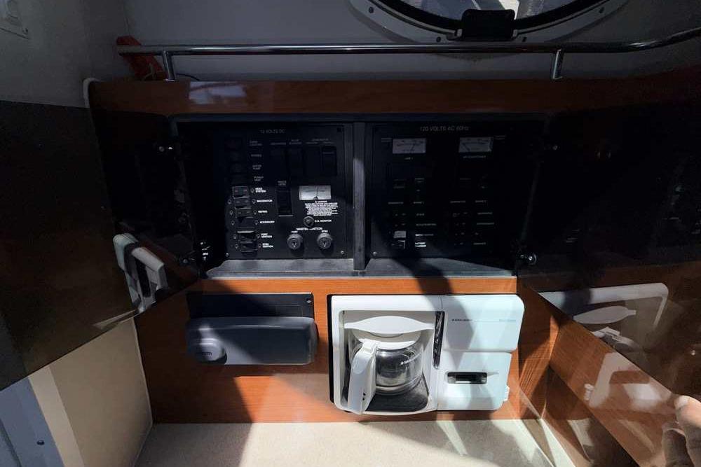 Control panel and coffee maker inside a 2001 Monterey 282 Cruiser boat cabin.
