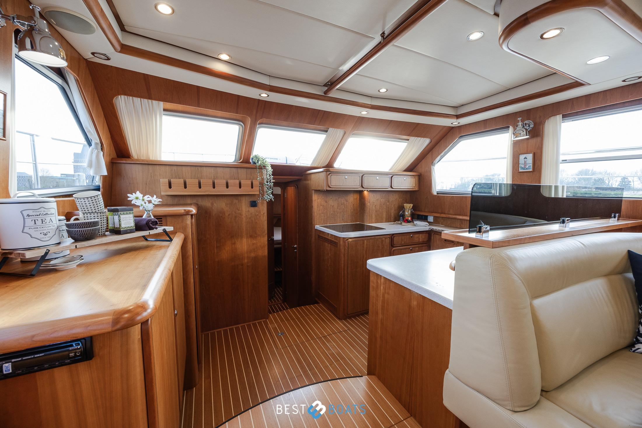 Luxurious interior of 2009 Linssen Grand Sturdy 500 Variotop MKII yacht with wooden finishes.