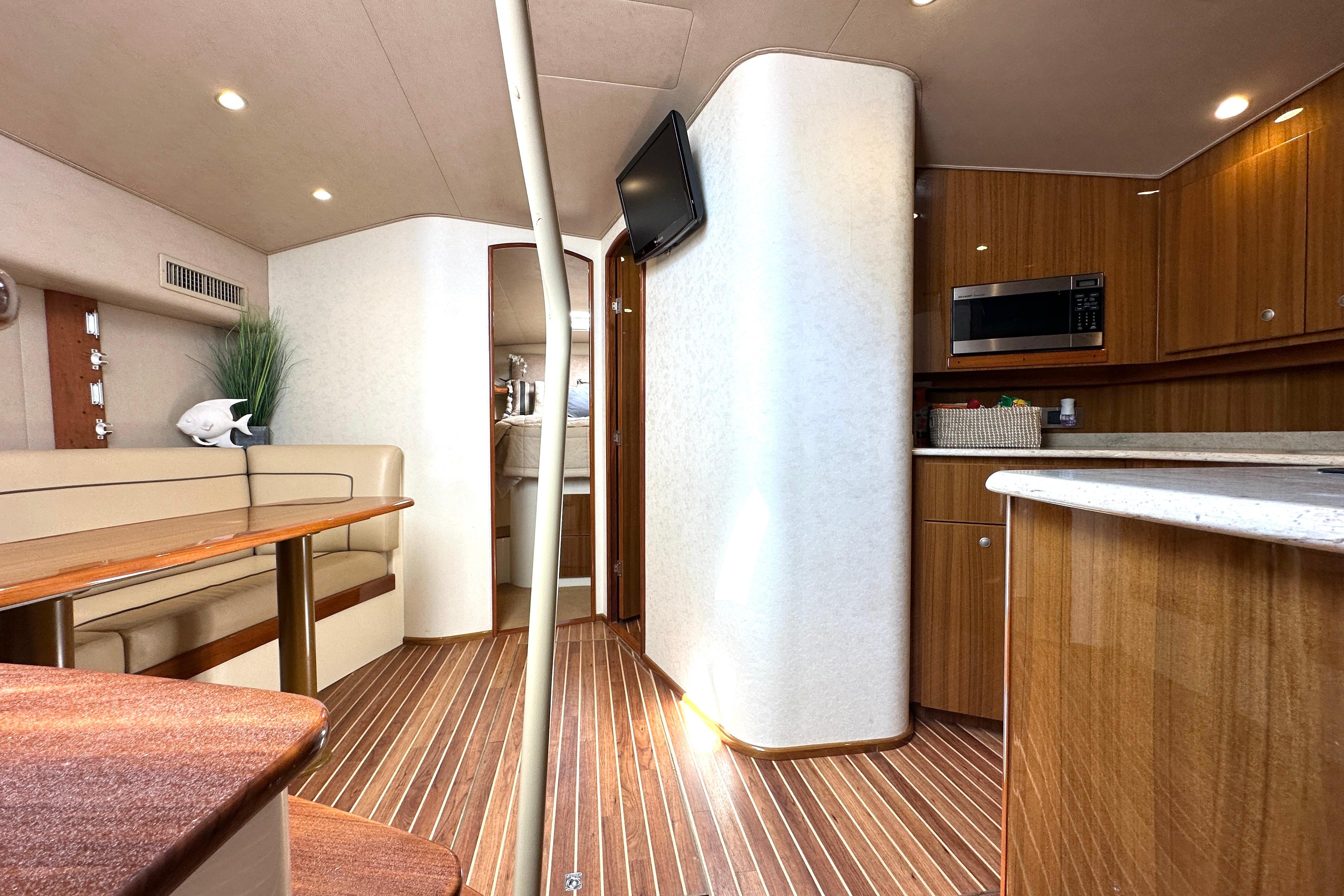 Interior of 2012 Viking 42 Open yacht with modern kitchen and seating area.