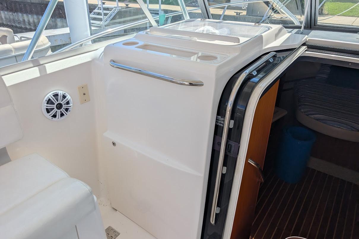 2000 Pursuit 3400 Express boat interior with seating and cabin entrance.