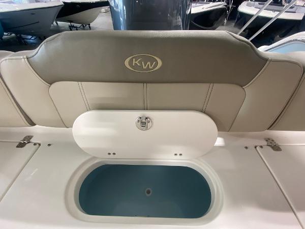 2024 Key West 189 FS boat interior with livewell and cushioned seating.