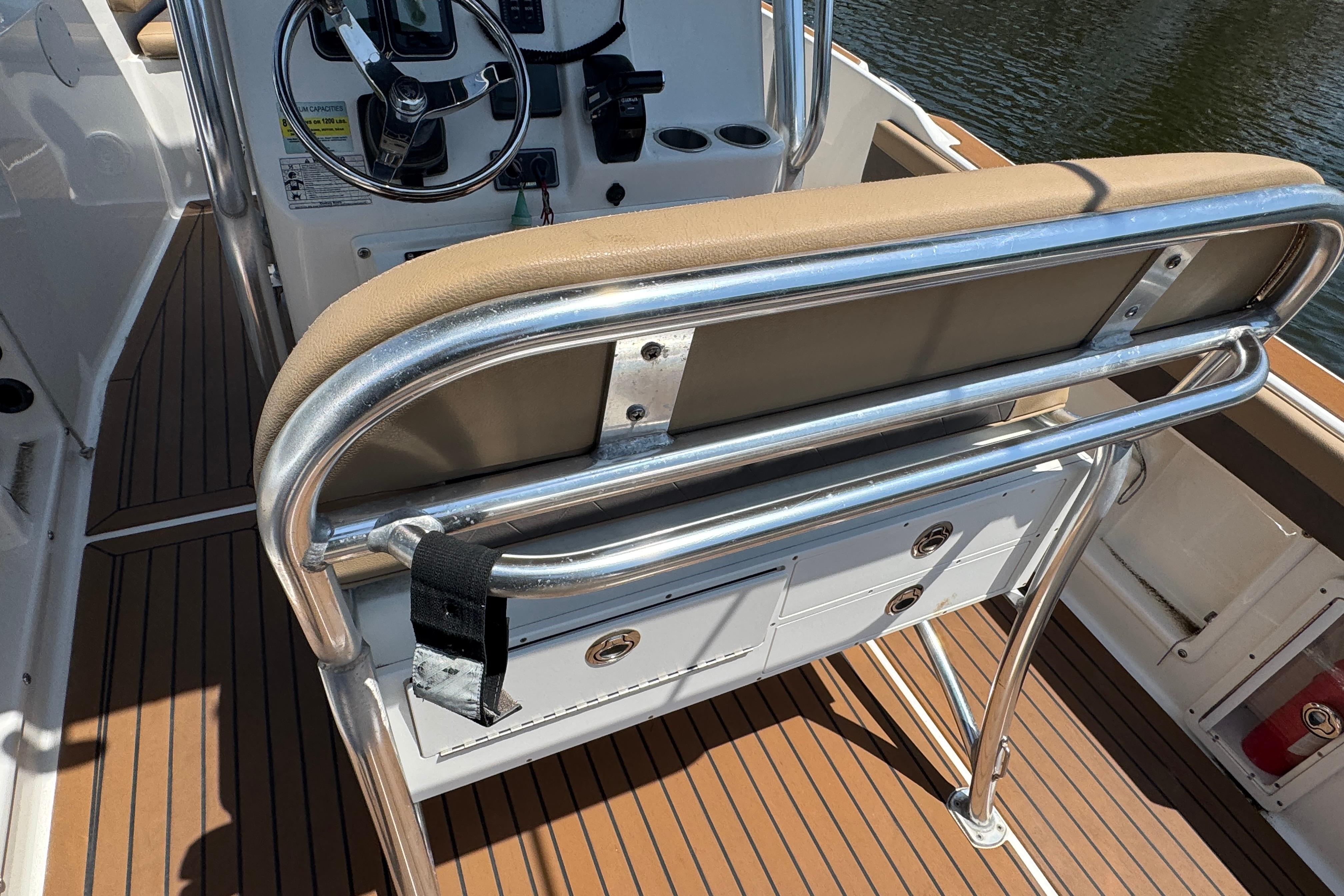 2014 Century 2301 Center Console boat interior with steering wheel and seating.