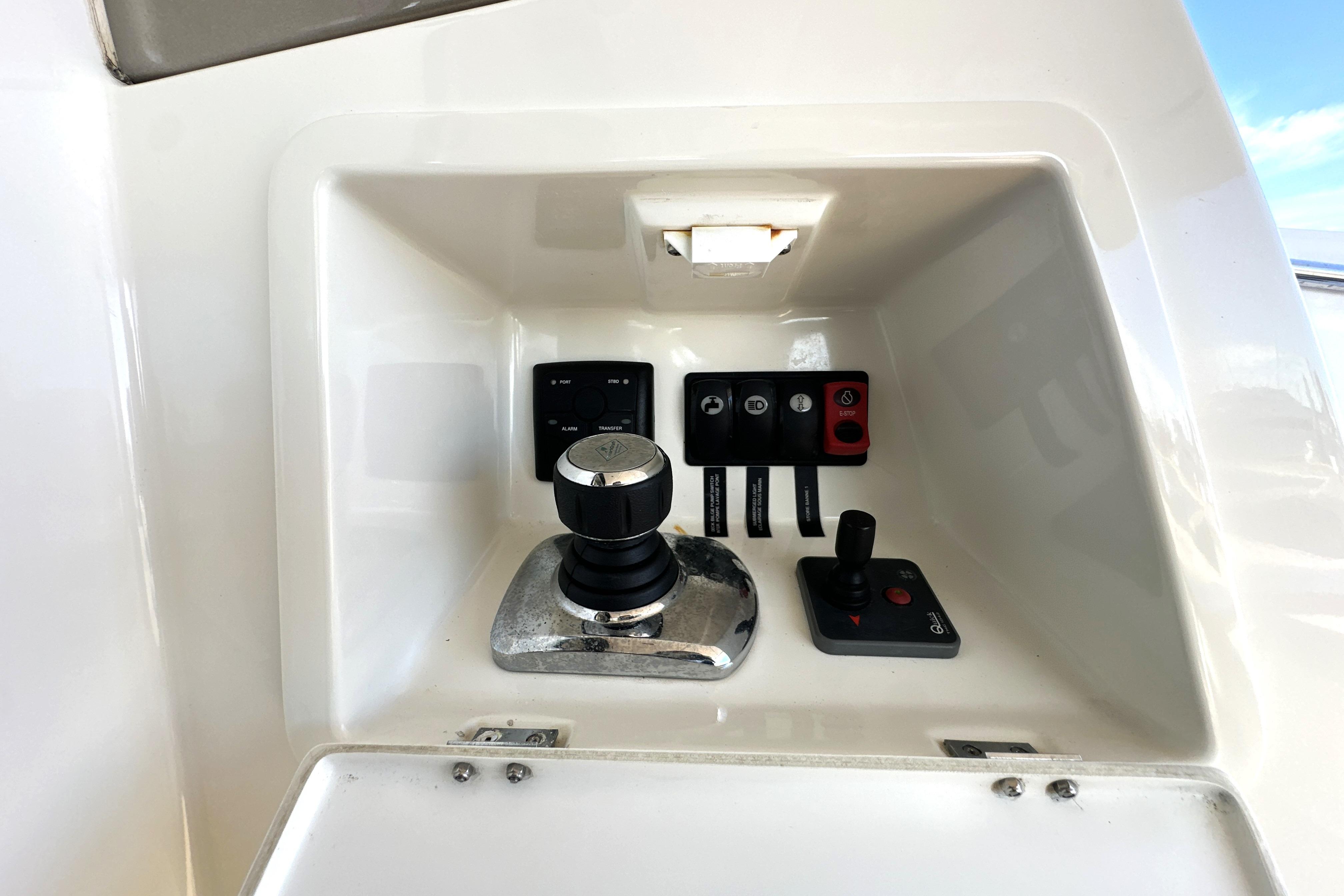 Control panel of a 2016 Prestige 550 yacht with joystick and switches.