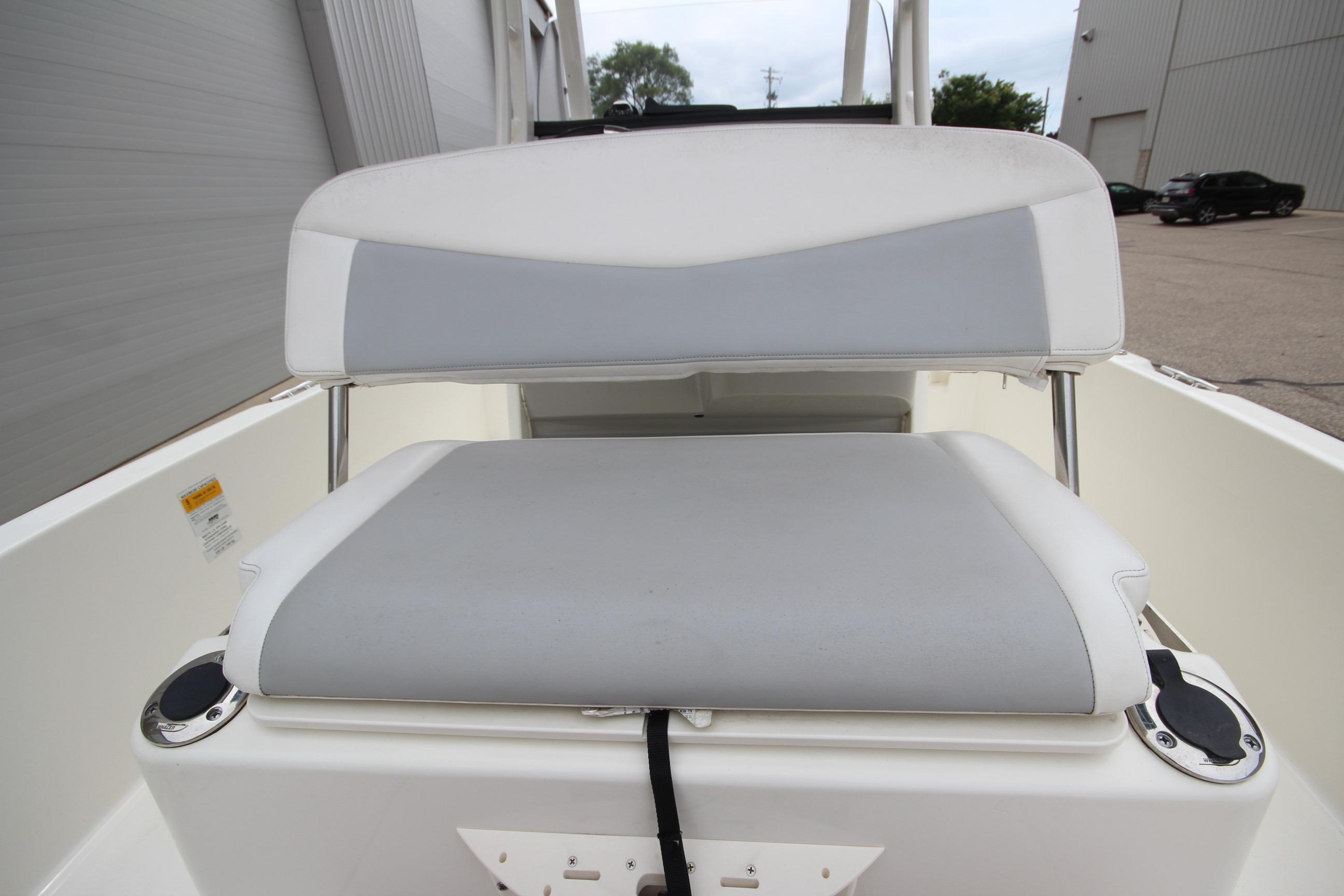 2014 Boston Whaler 210 Dauntless boat seat with gray and white upholstery.