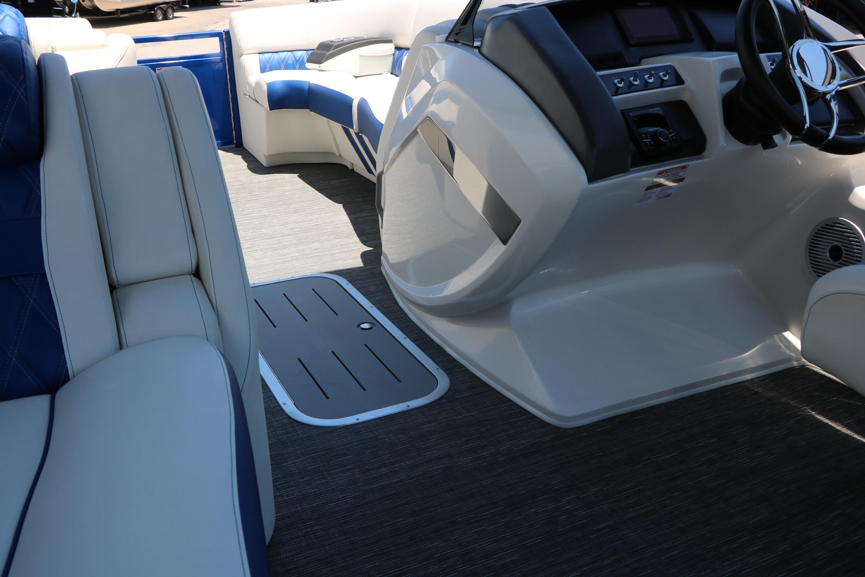 2024 Bennington 23 RX Swingback interior with luxurious seating and modern helm design.