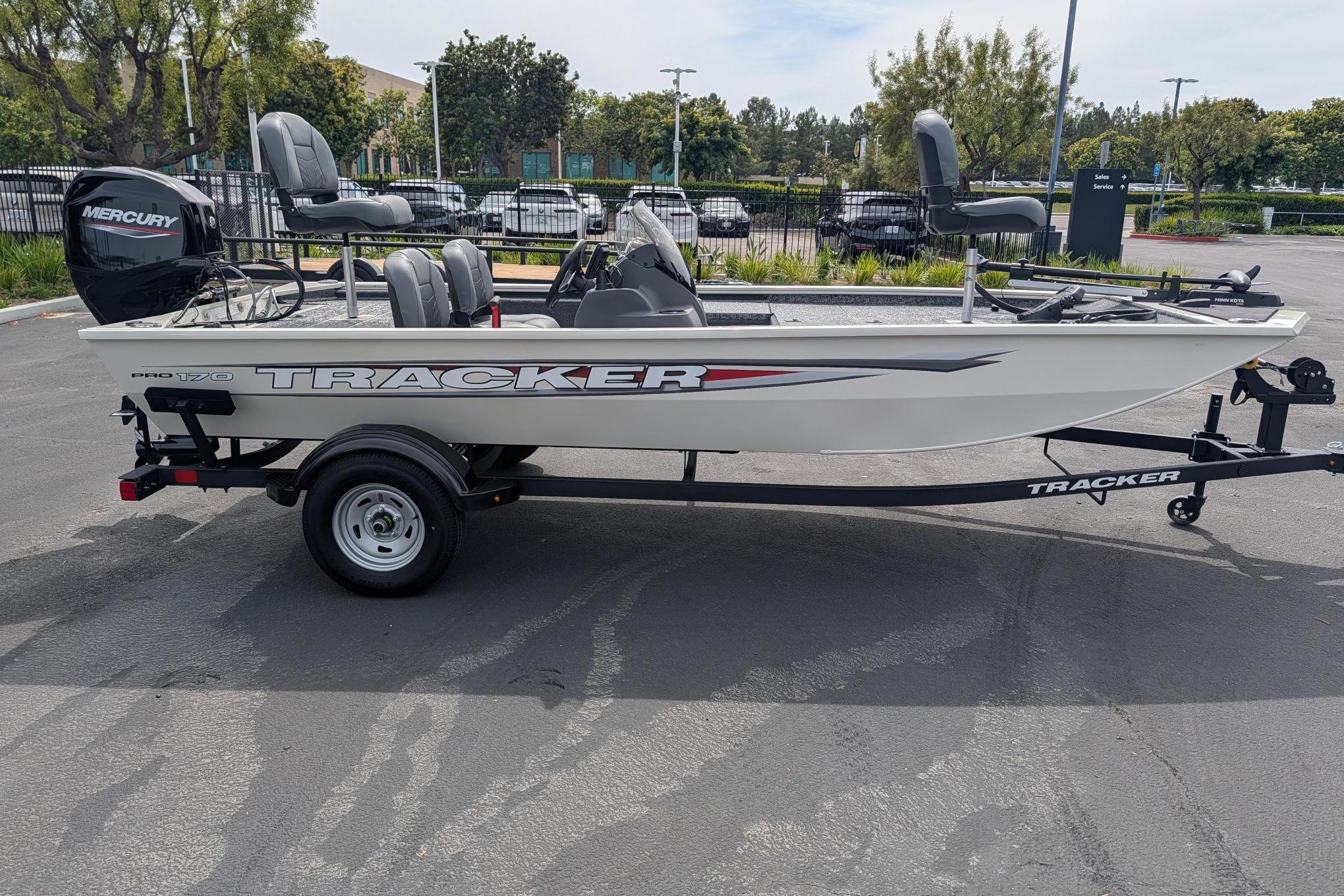 2026 Tracker Pro 170 boat on trailer in parking lot.