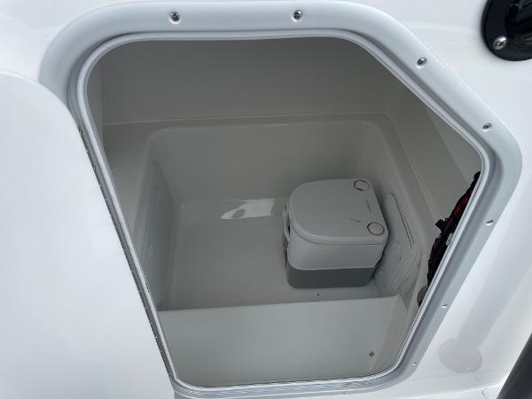 Portable toilet inside 2026 Cape Horn 24XS boat compartment.