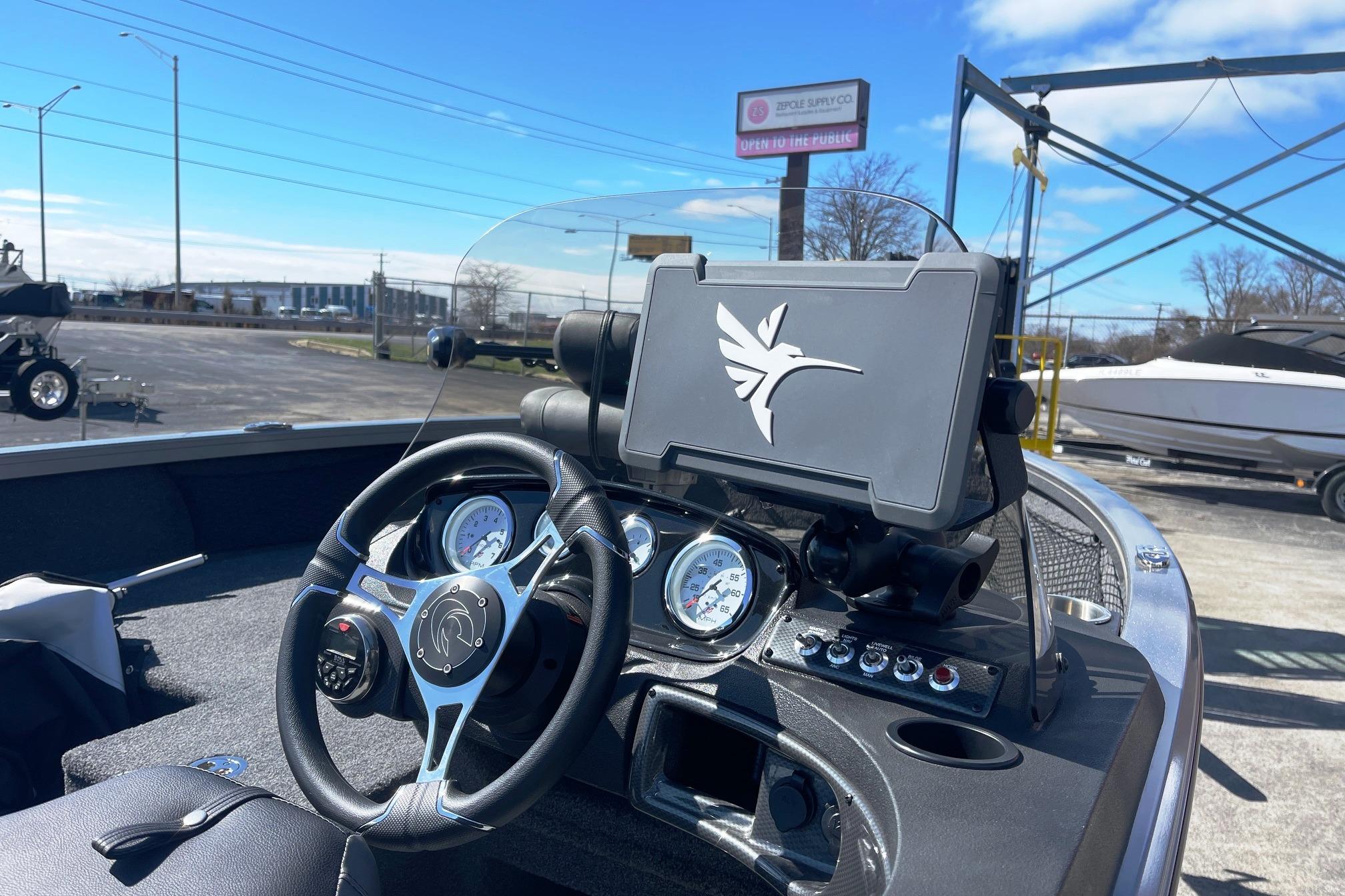 2023 Crestliner 1650 Fish Hawk dashboard with steering wheel and navigation system.