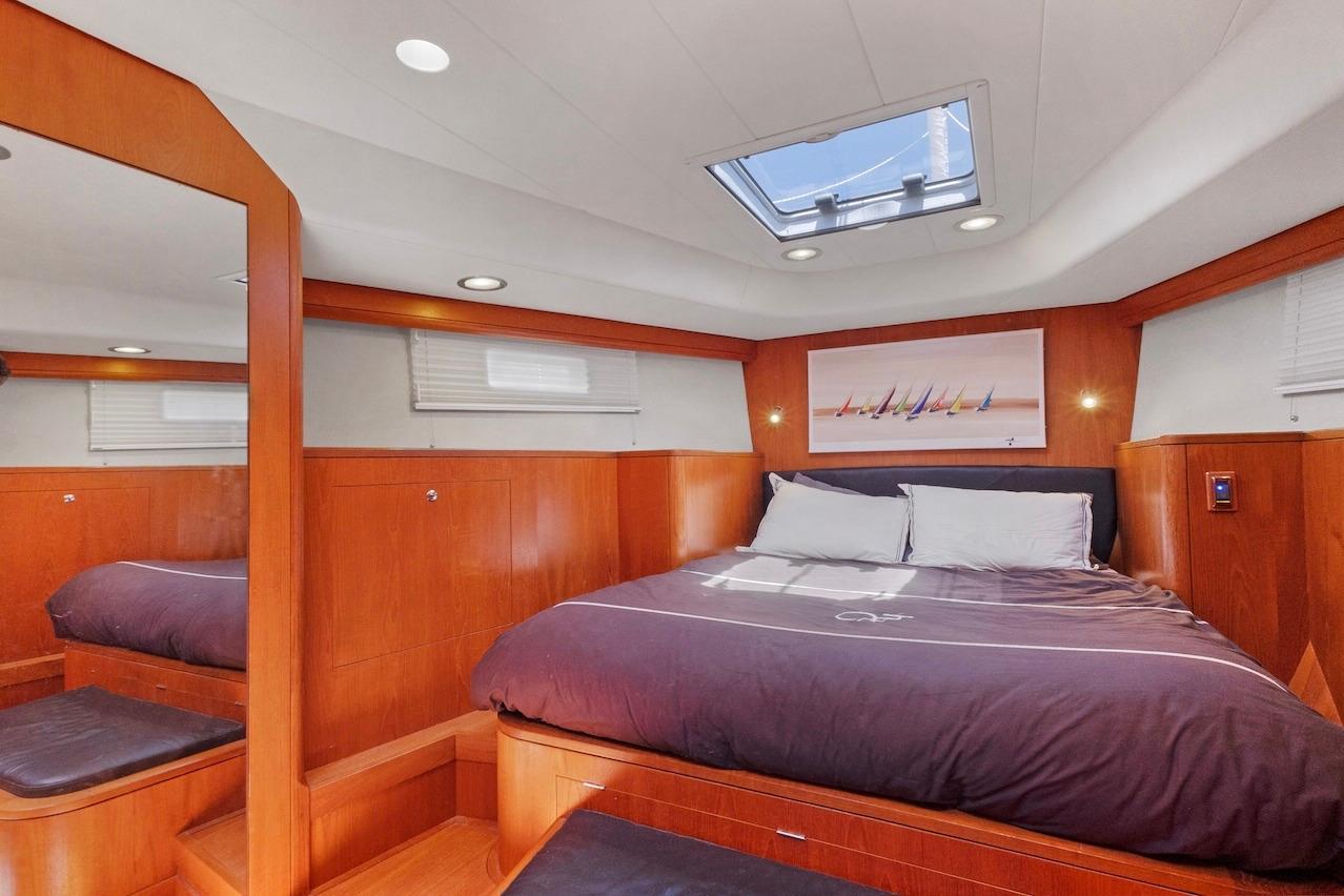 Luxurious cabin interior of 2011 Southerly 57 RS yacht with skylight and wooden finish.