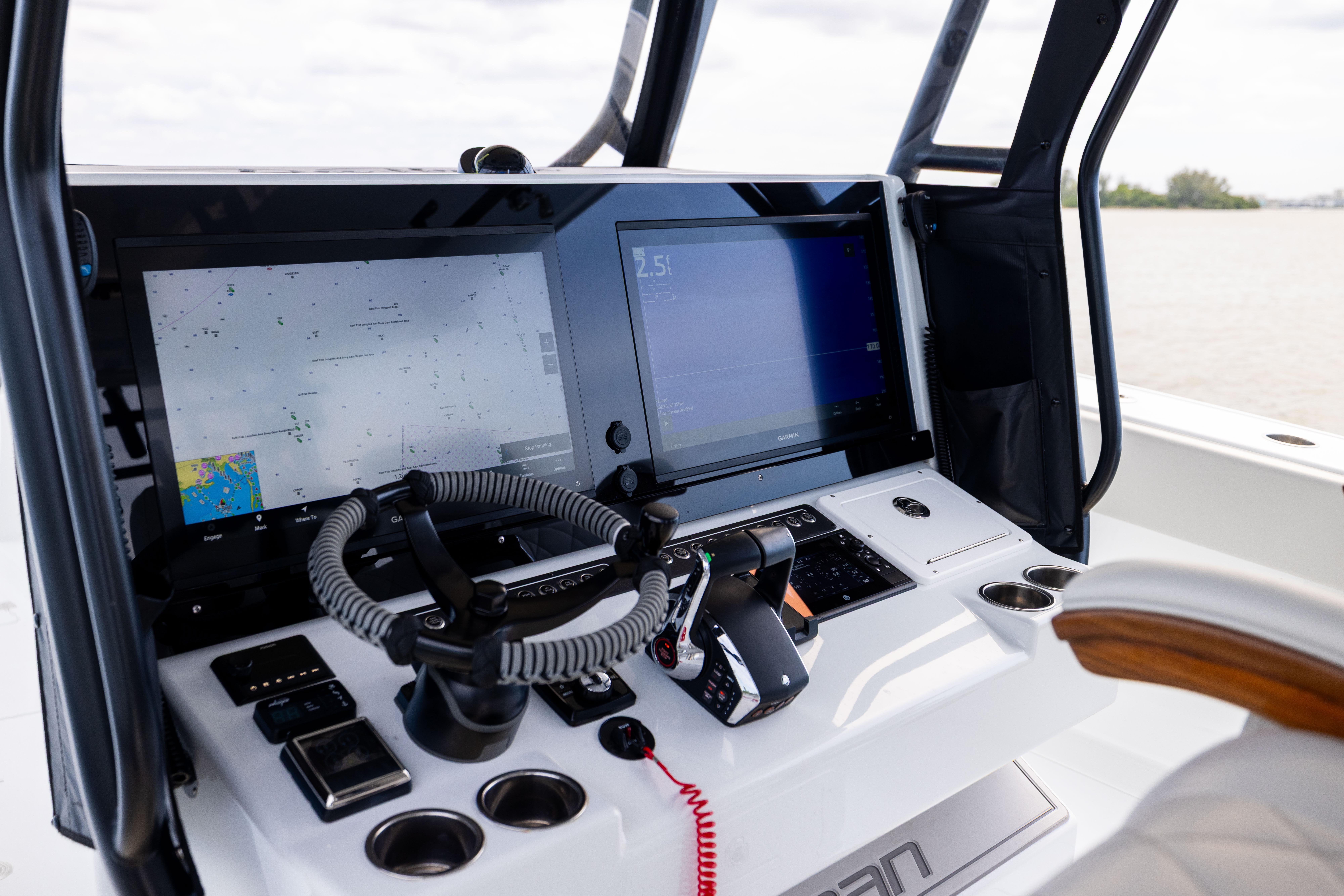 Freeman 42 LR 2025 boat dashboard with advanced navigation screens and controls.