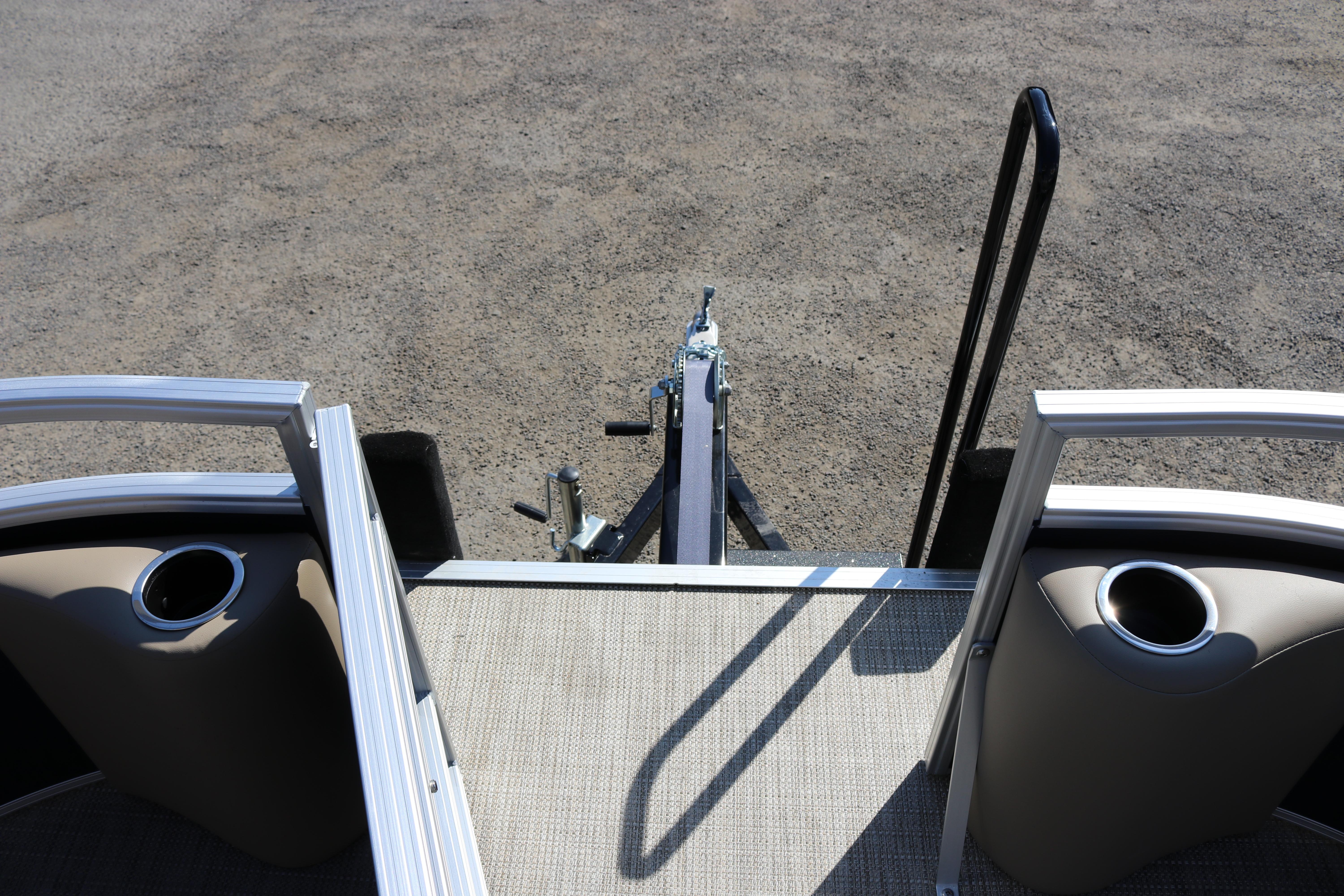 2025 Sun Chaser Vista Fish 18 pontoon boat with trailer hitch and cup holders.