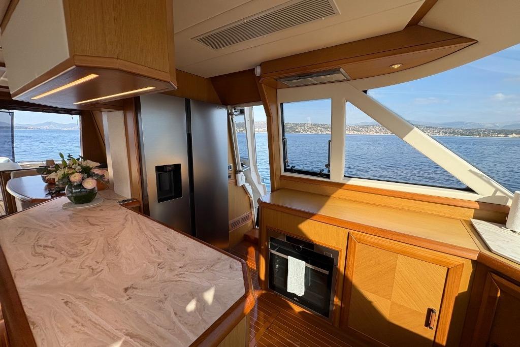 Luxurious interior of 2006 Mochi Craft 74' Dolphin yacht with ocean view.
