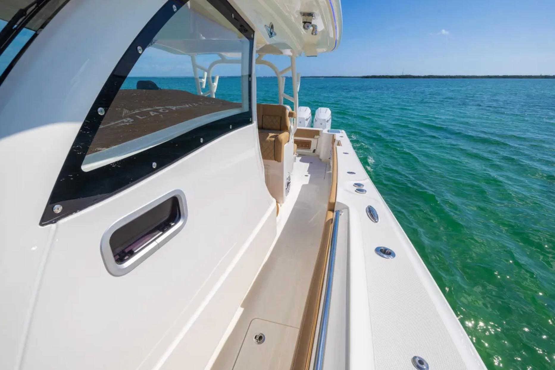 2025 Blackwater 41 Performance Fish boat on clear blue water, side view.