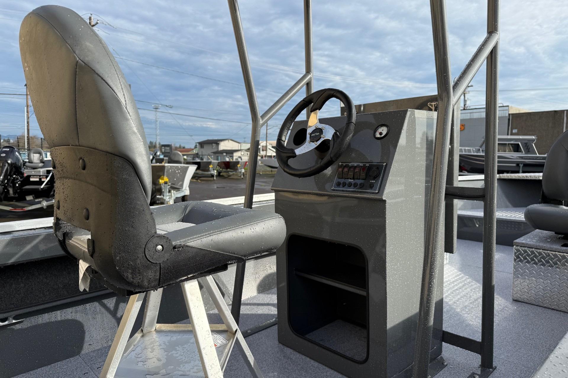 2026 Fish Rite Angler 18 boat interior with steering console and seating.