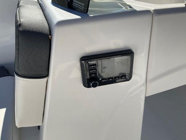 2025 Tahoe T18 boat interior with control panel and cushioned seating.