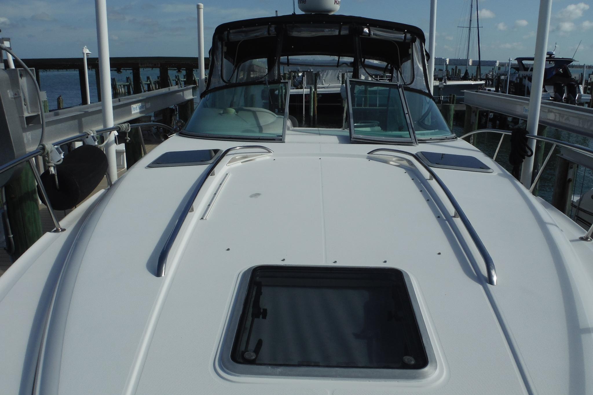 2005 Chaparral Signature 350 yacht docked, showcasing sleek deck design and windshield.