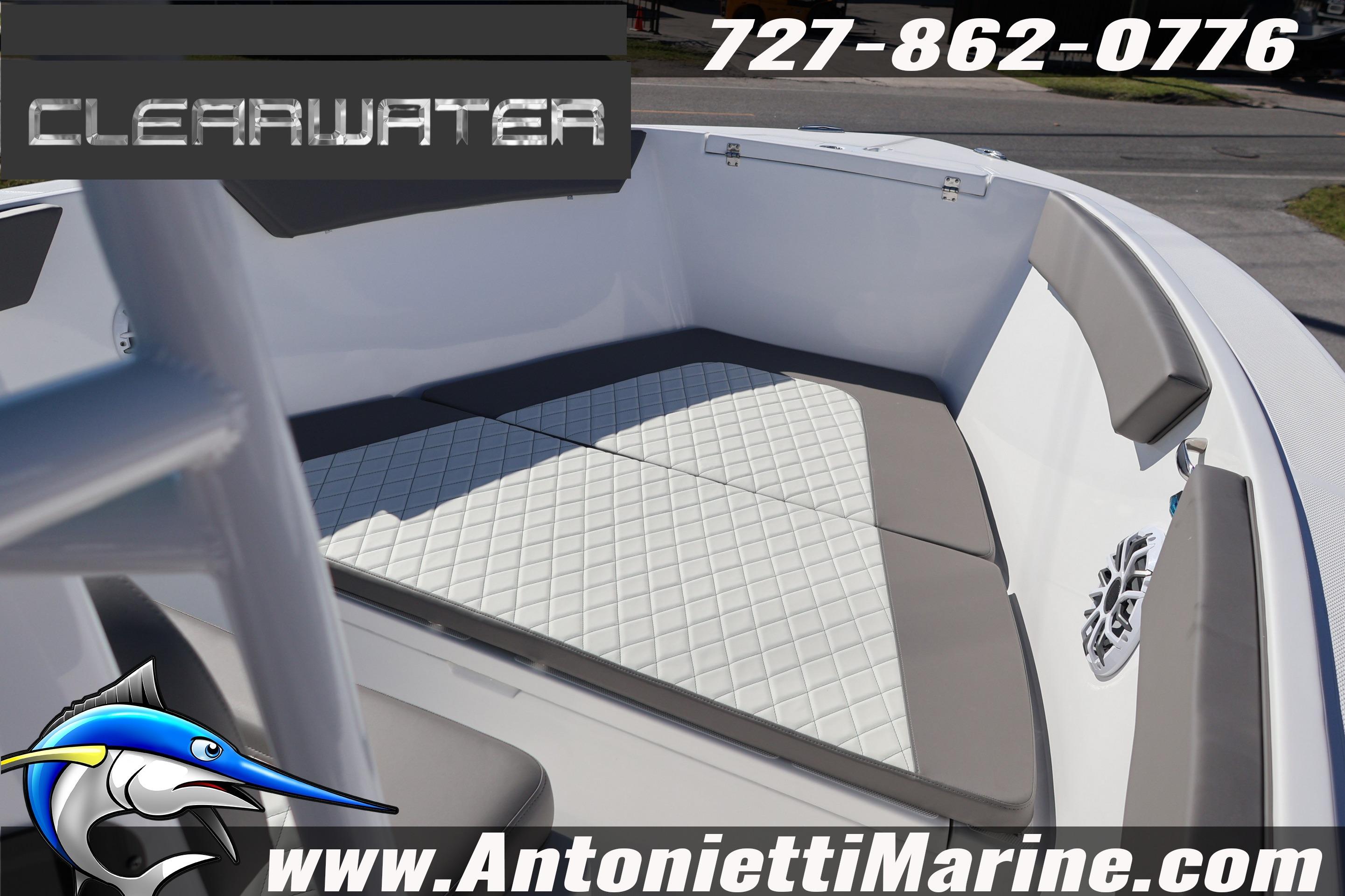 2026 Clearwater 2300 boat interior with cushioned seating, showcased by Antonietti Marine.