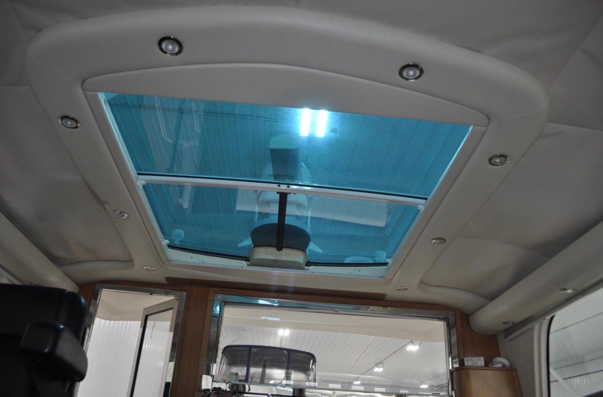 Interior view of a 2005 Tiara Yachts 5200 Sovran with a large glass ceiling.