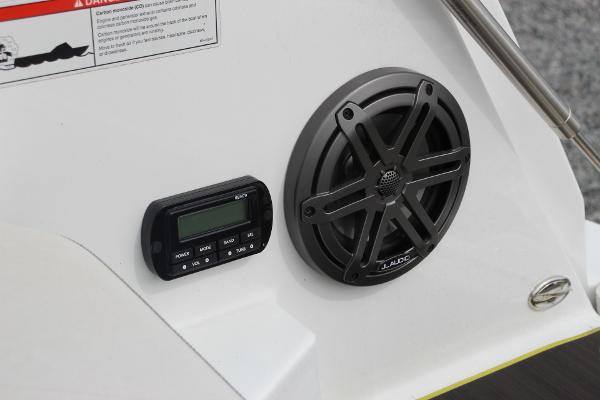 2023 Scarab 255 Open ID boat audio system with speaker and control panel.