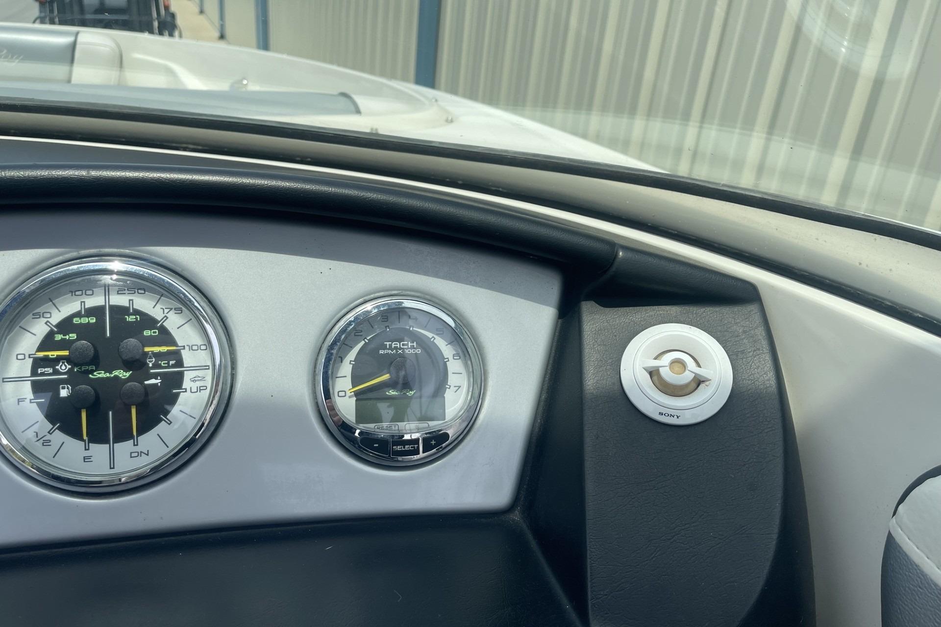 Dashboard of 2010 Sea Ray 230 Bow Rider Select with gauges and Sony control.