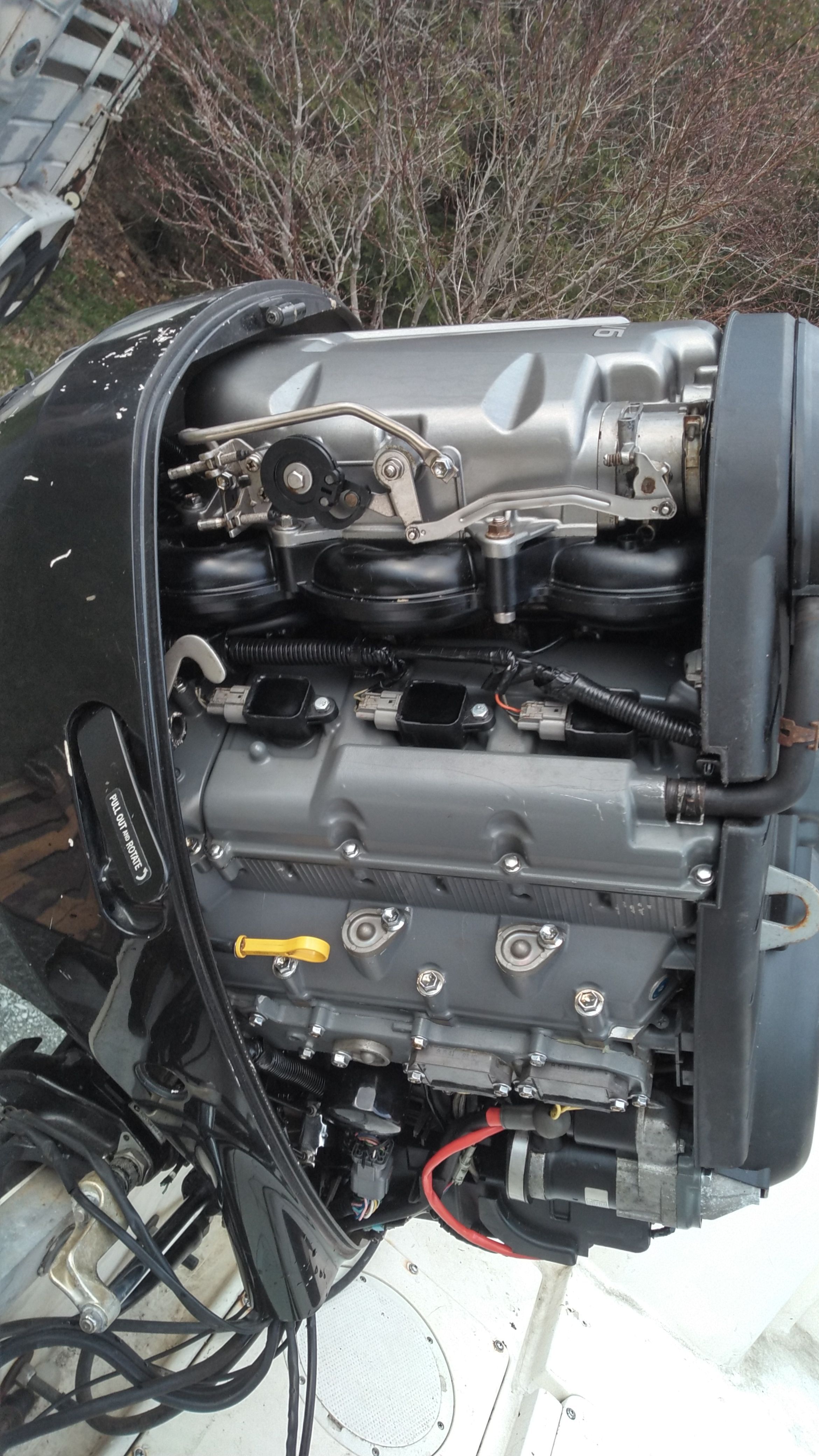 An outboard motor of a boat with visible mechanical components.