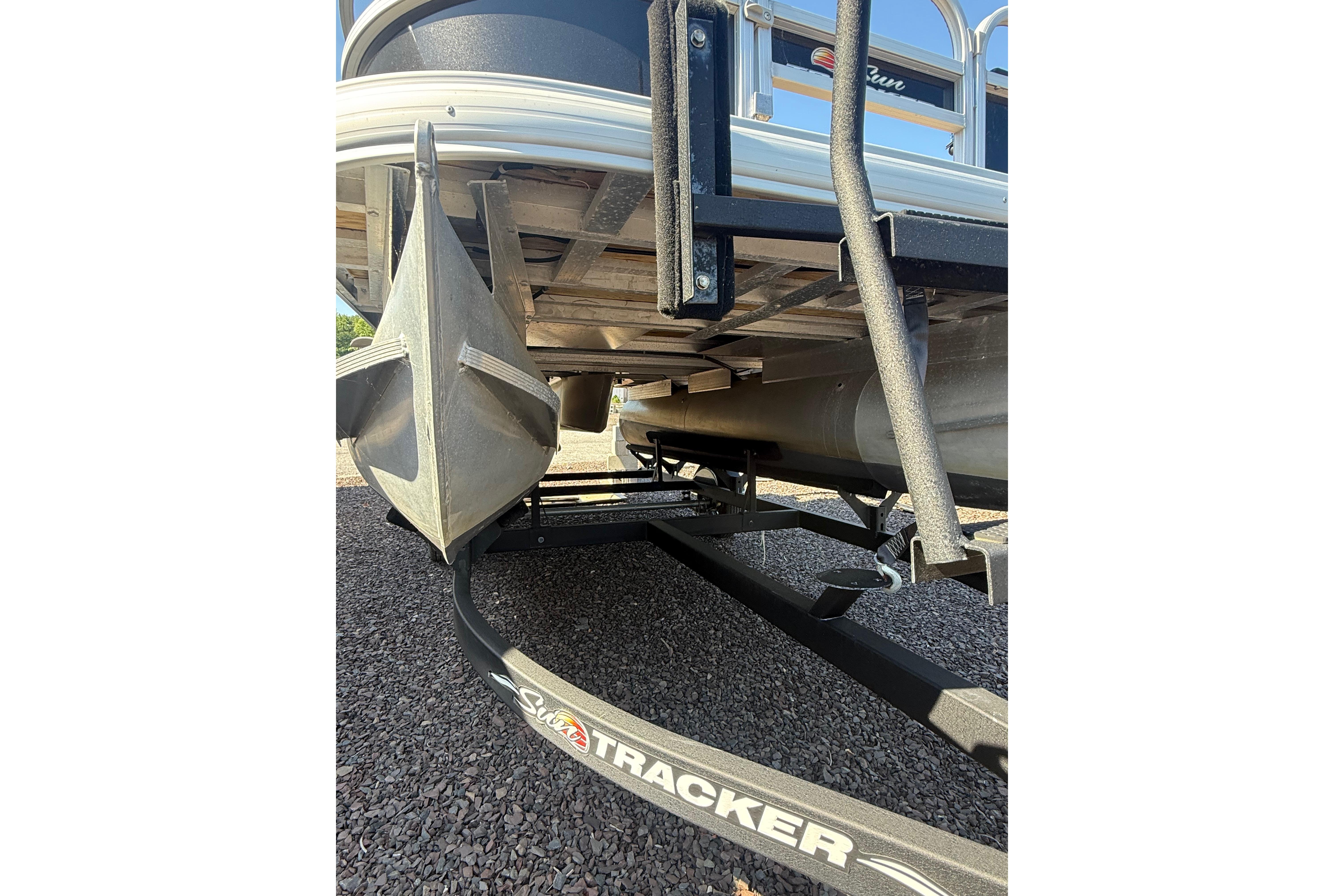 2021 Sun Tracker Bass Buggy 16 XL Select pontoon boat on trailer, underside view.