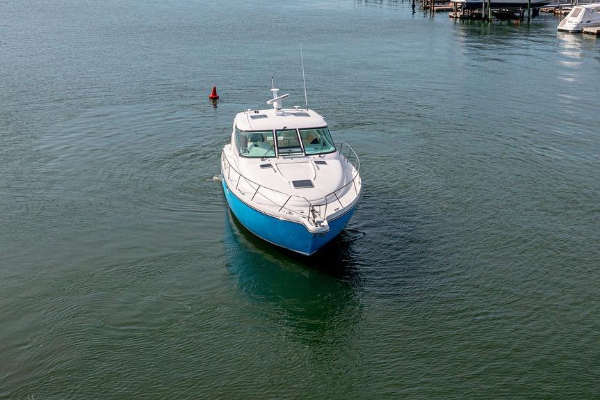 2006 Tiara Yachts 4300 Sovran cruising on calm waters.
