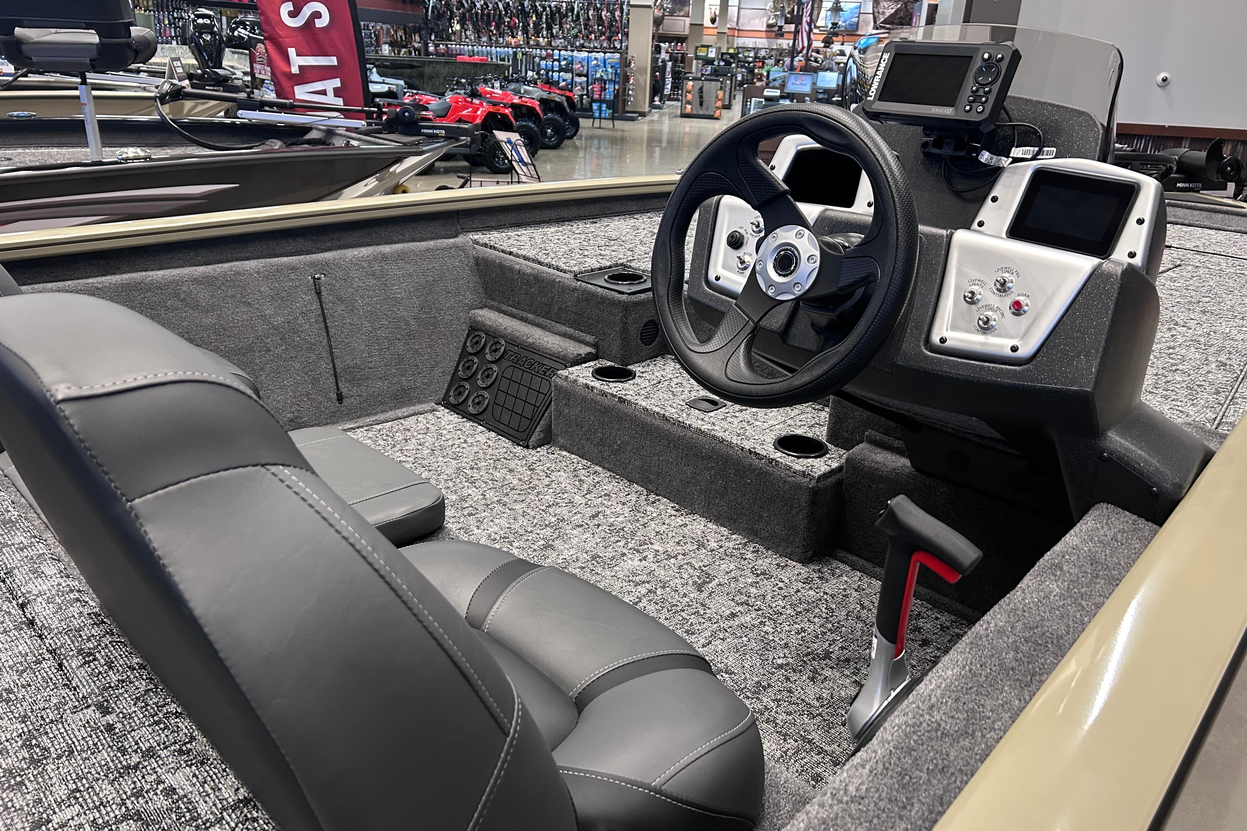 2026 Tracker Pro Team 195 boat interior with steering wheel and control panel.