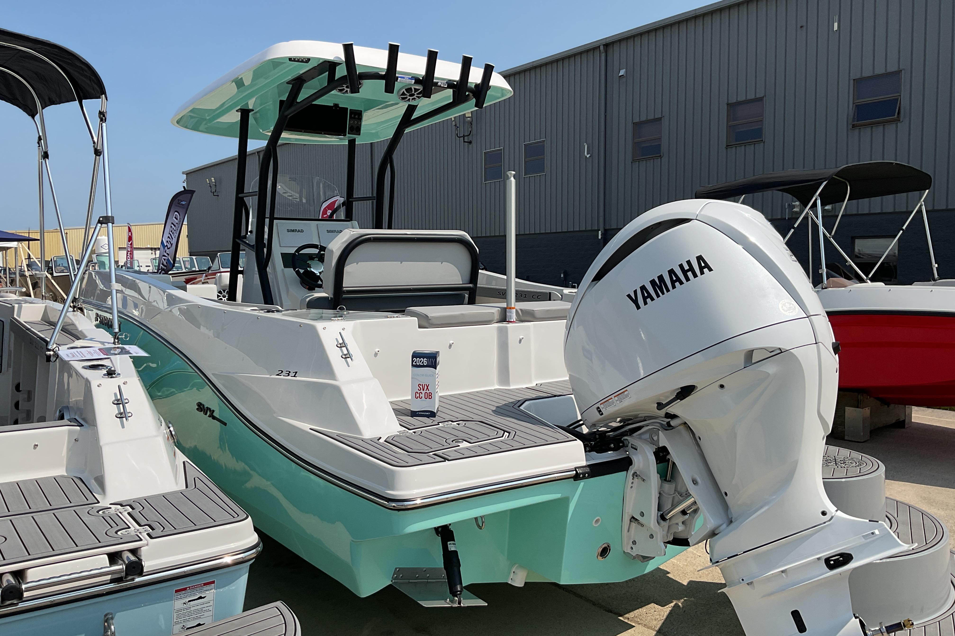 2026 Starcraft SVX 231 OB CC boat with Yamaha engine, displayed outdoors.