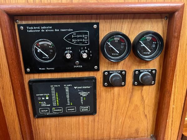 Dashboard with tank level indicator and control gauges.
