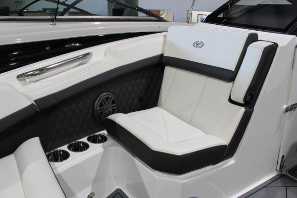 2025 Cobalt R6 boat interior with luxurious white seating and cup holders.