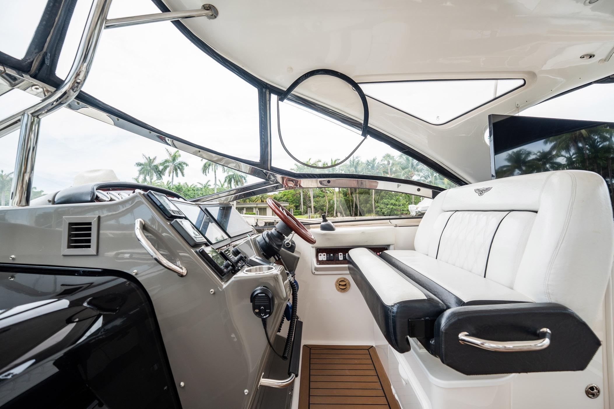 Interior of 2008 Regal Commodore 4460 yacht with modern helm and luxurious seating.
