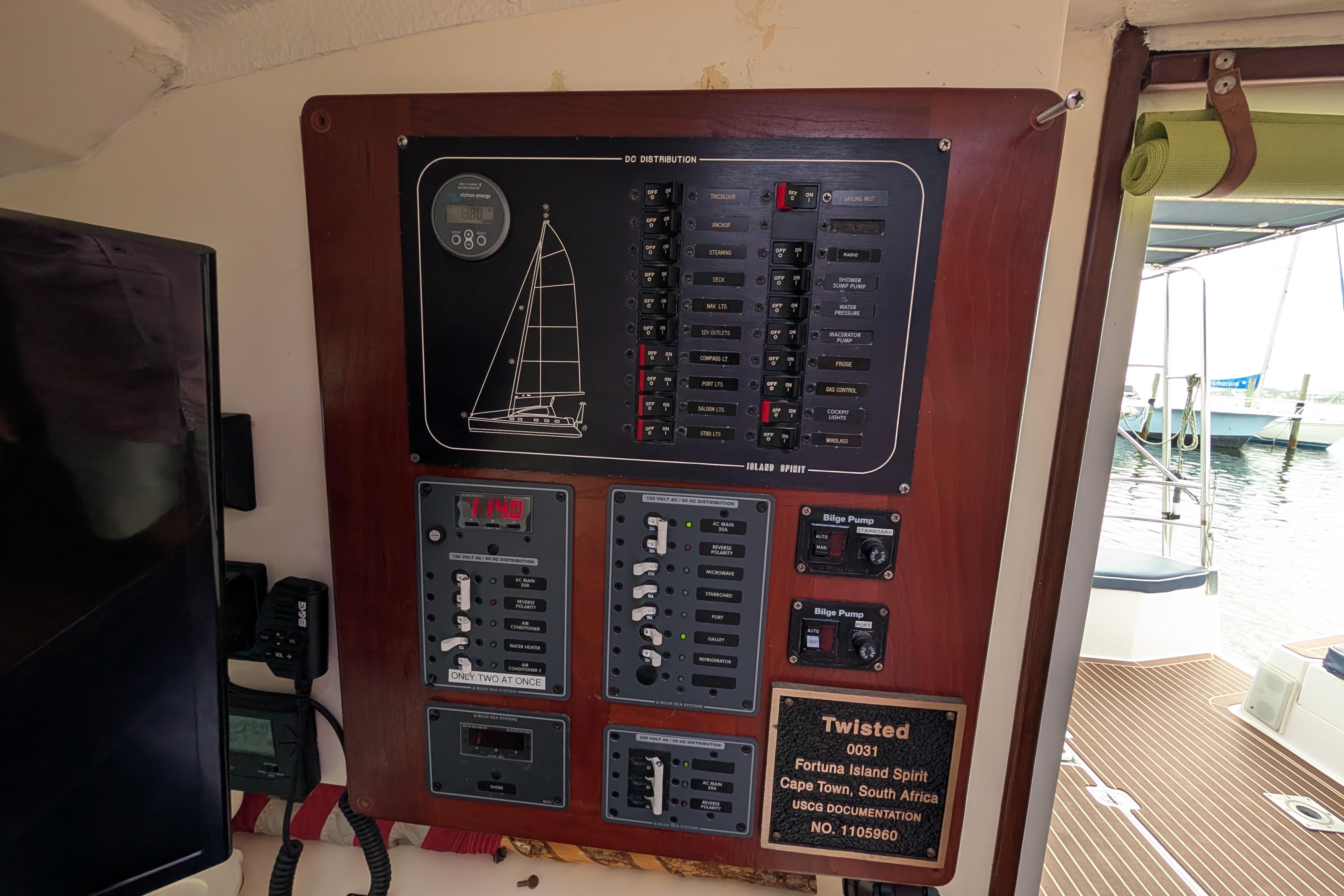 Electrical panel on 1999 Island Spirit 37 yacht, featuring switches and bilge pump controls.