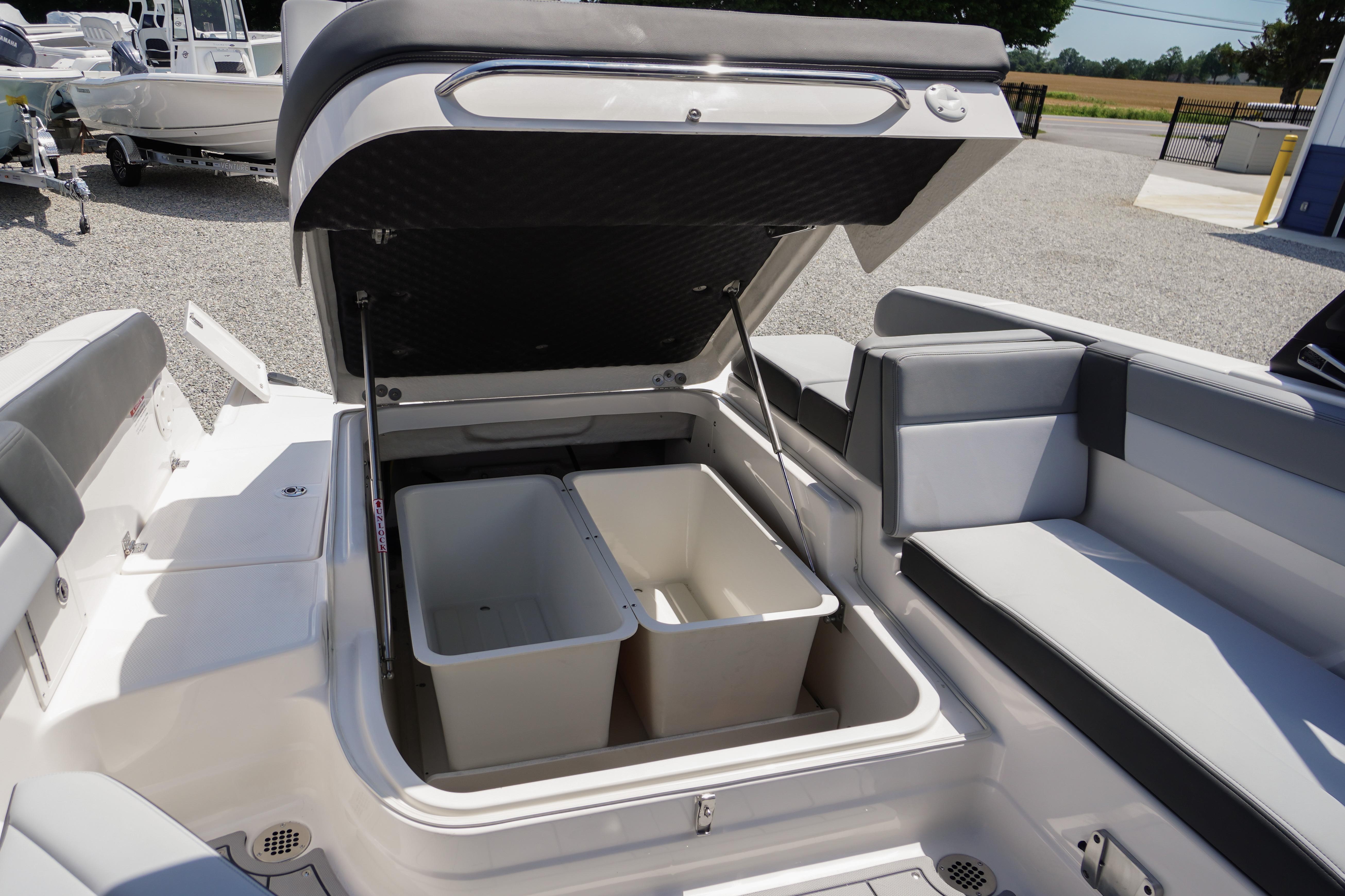2026 Chaparral SSX 4 boat interior with open storage compartment and seating.