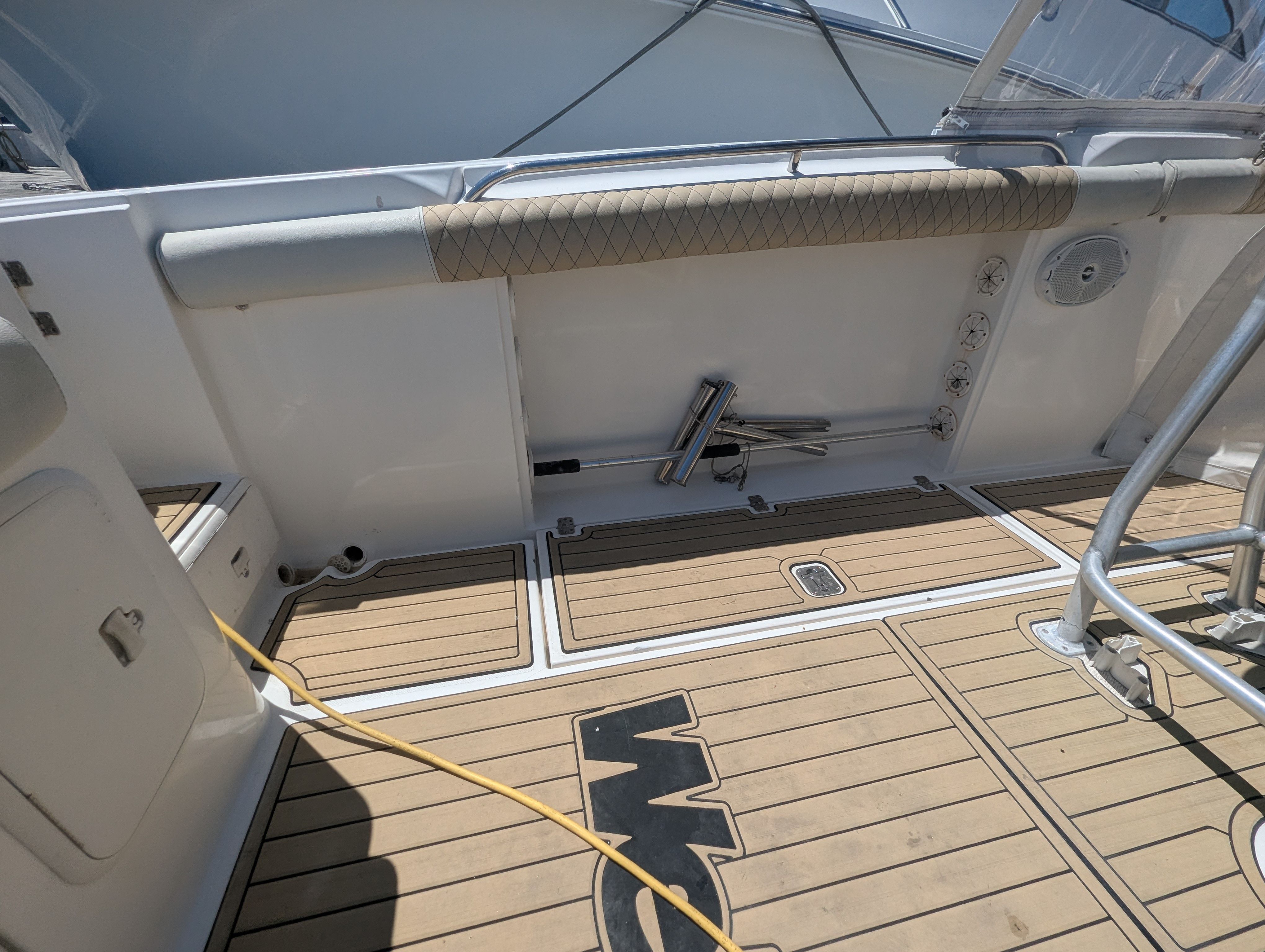 Interior of a 2005 Wellcraft 35 CCF boat with wooden flooring.