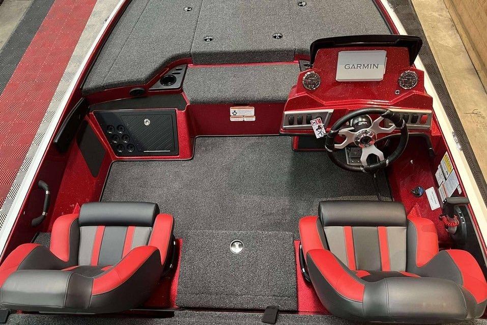 Interior of 2026 Nitro Z18 Pro boat with Garmin dashboard and red-black seating.