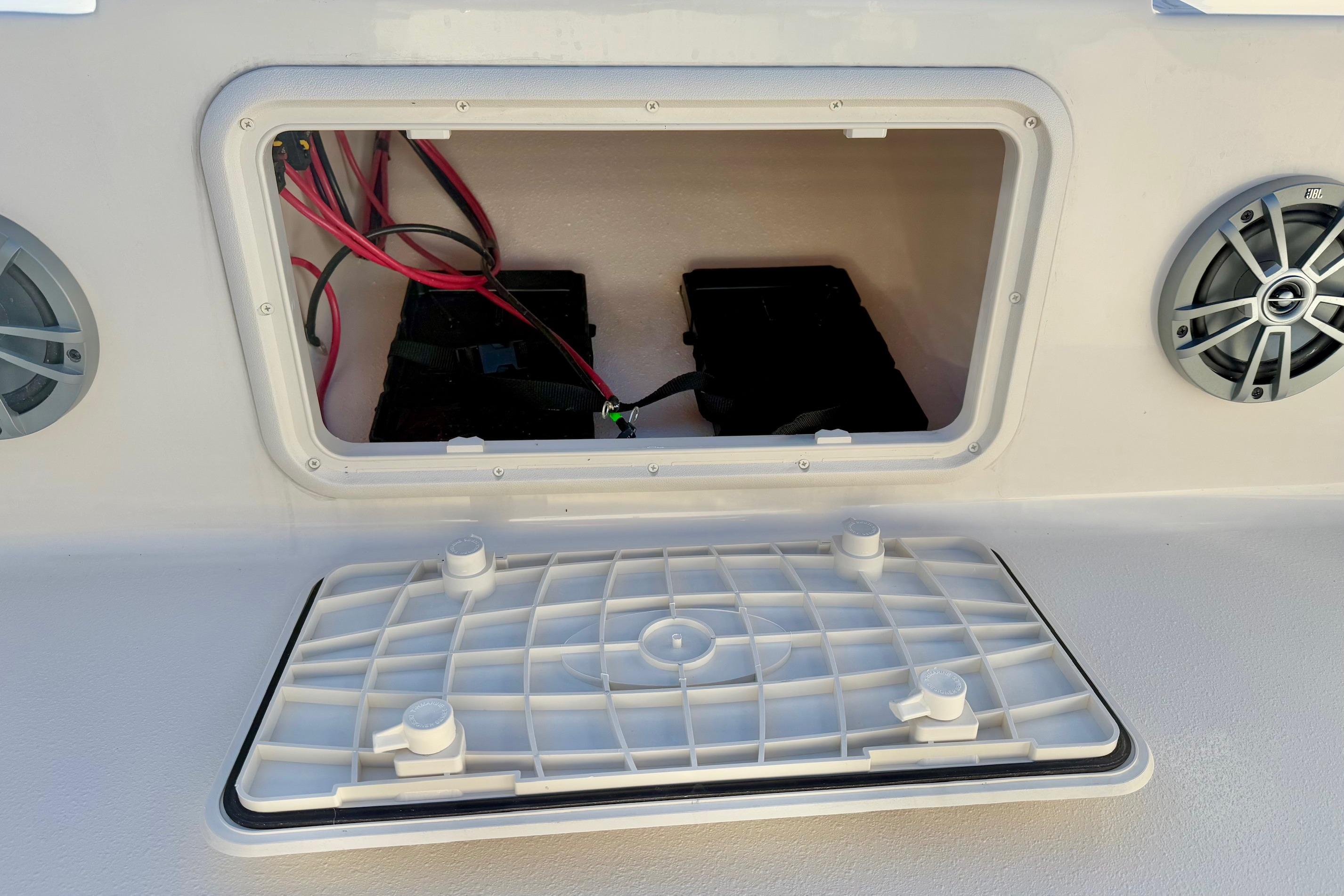 2025 Carolina Skiff 21 LS boat battery compartment with wiring and speakers.