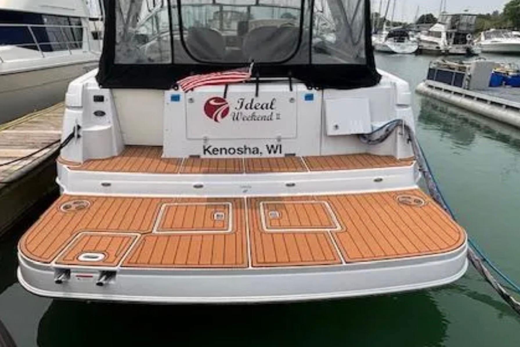 2007 Four Winns 378 Vista boat docked, featuring teak swim platform, Kenosha, WI.