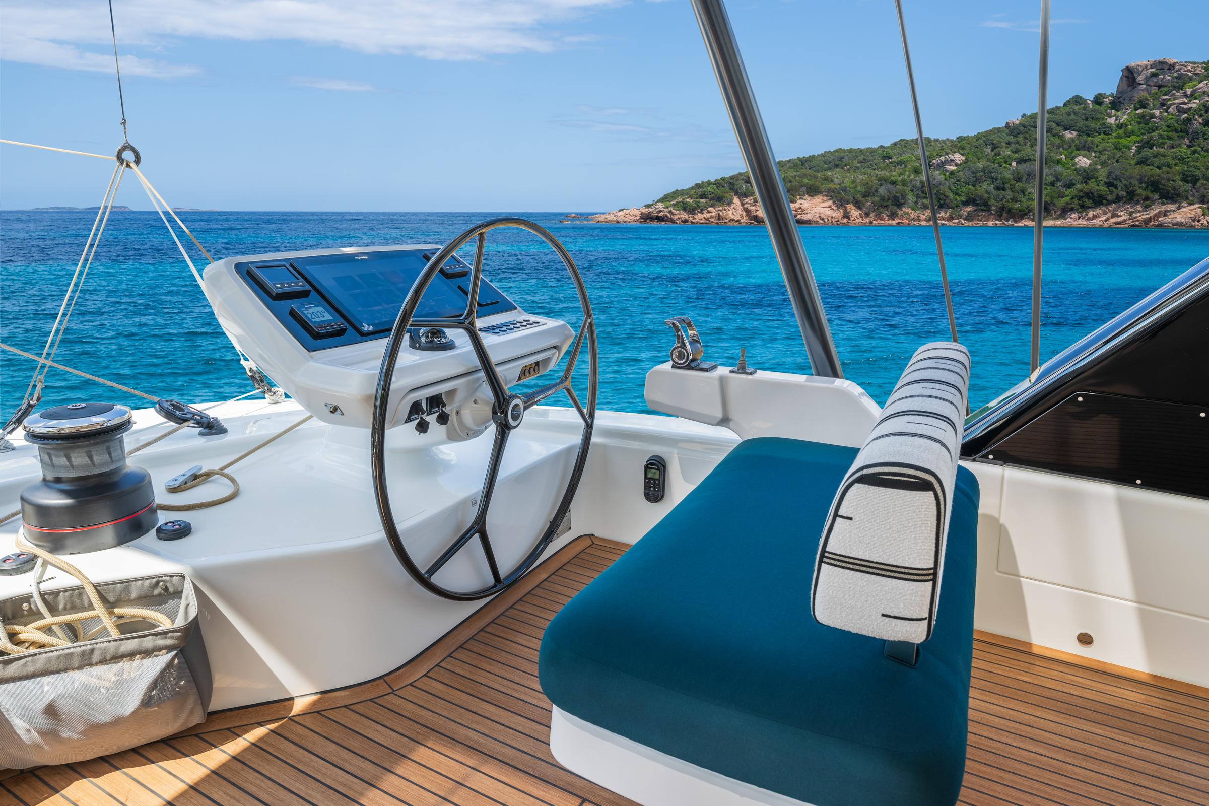 Helm of 2025 Lagoon Eighty 2 yacht with ocean view and modern controls.