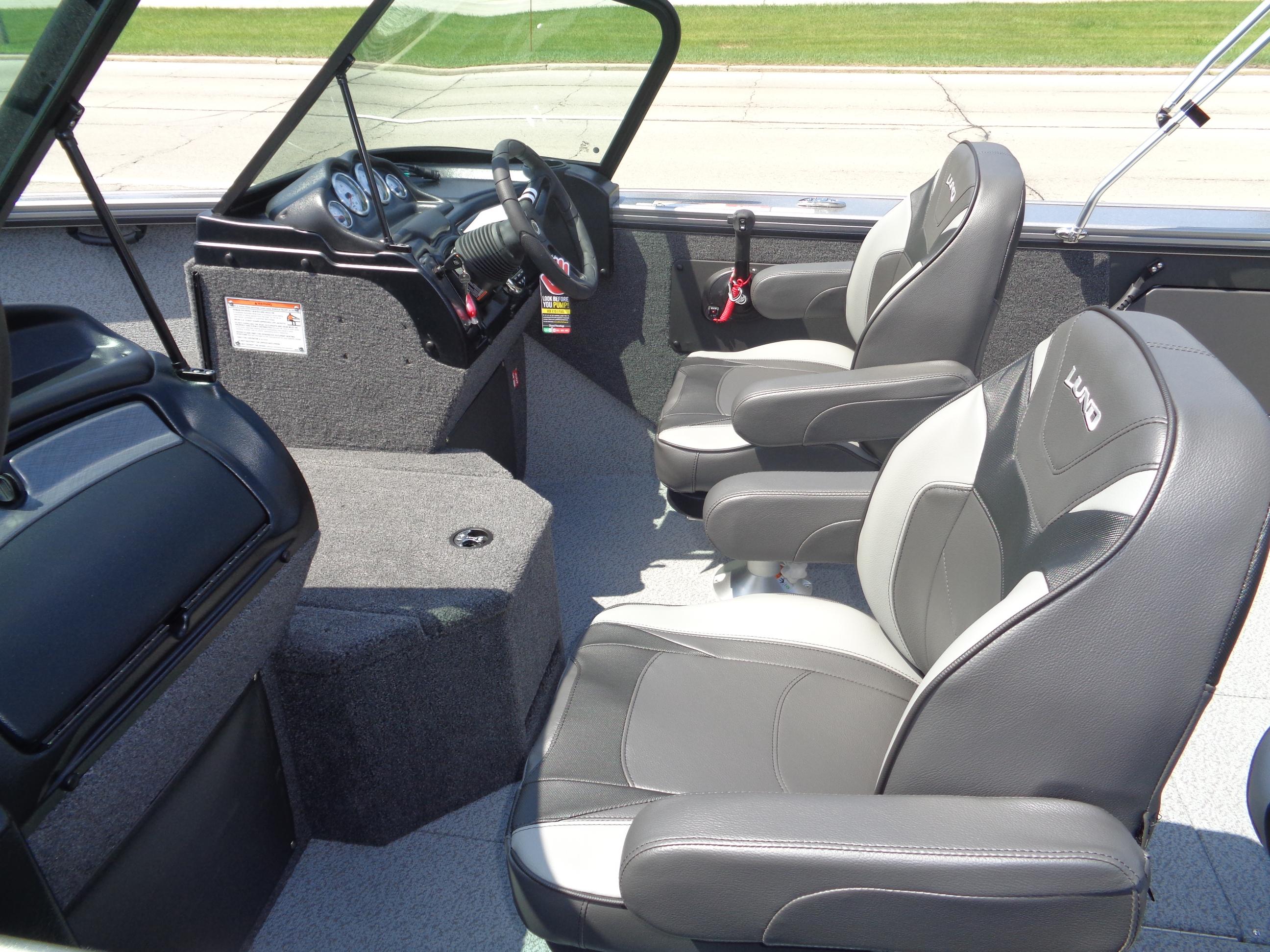 2025 Lund 2075 Fisherman boat interior with modern seating and dashboard.