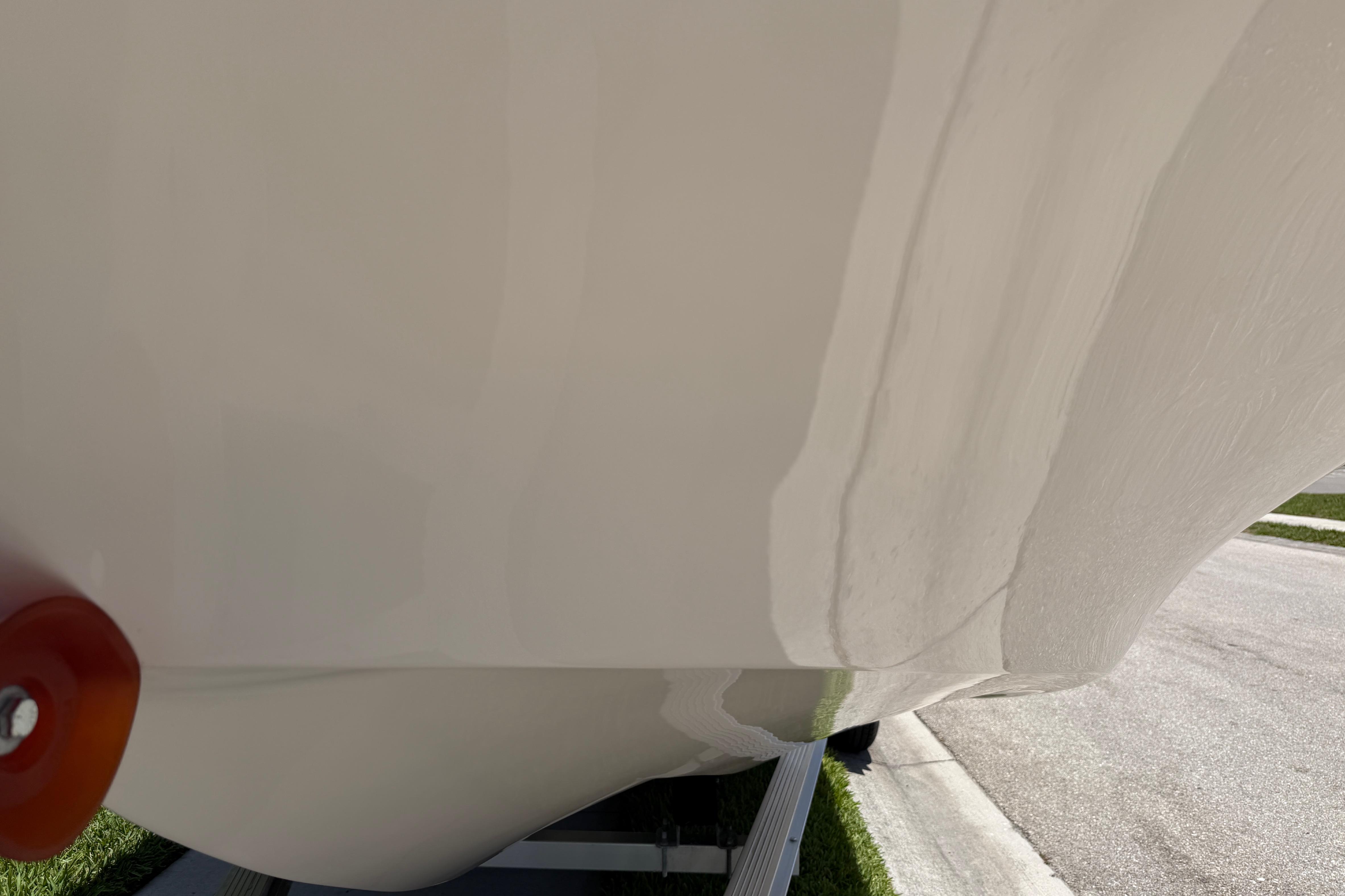 2023 Carolina Skiff 21 LS boat hull on trailer, close-up view.
