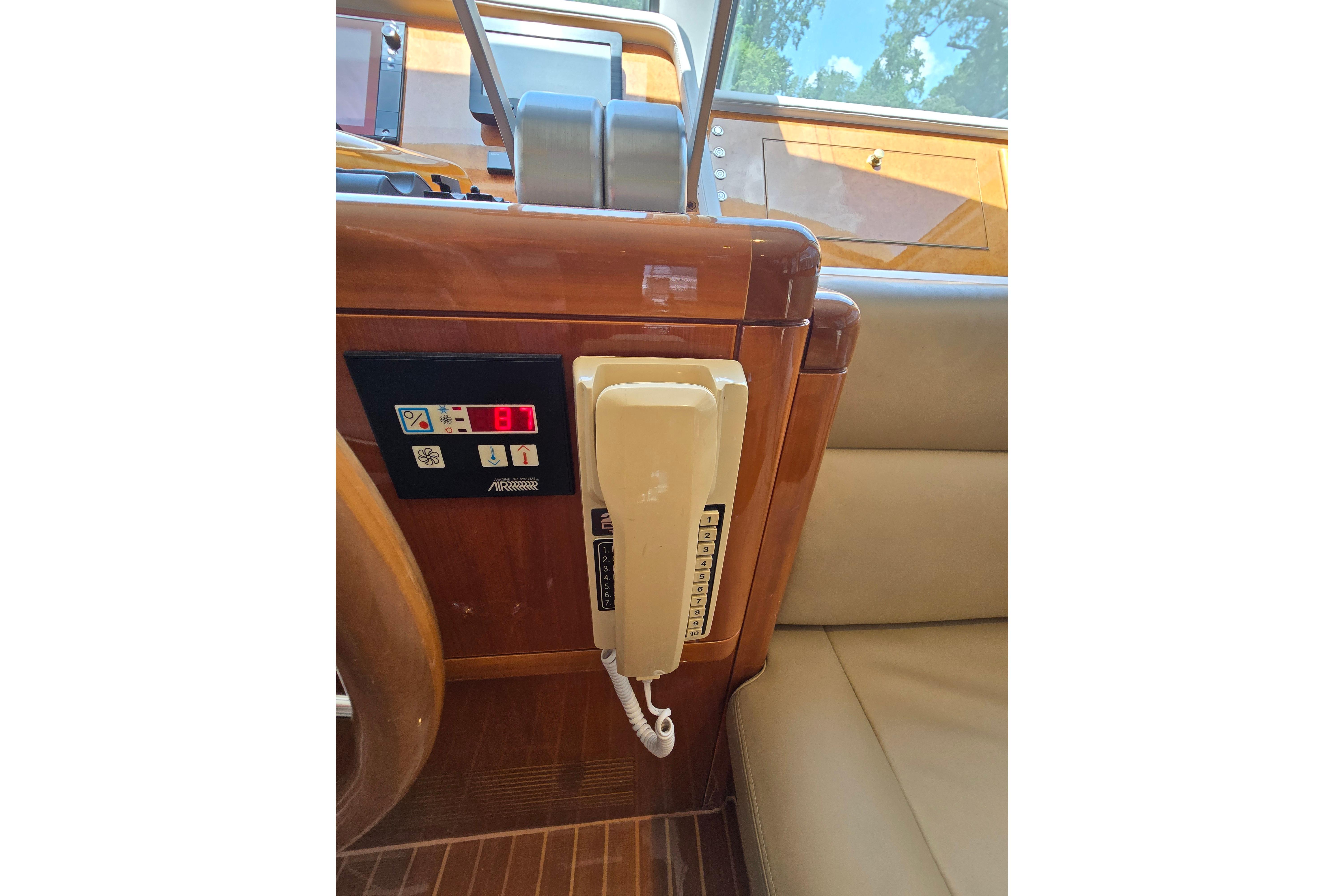 Control panel and phone on 2004 Grand Harbour 58 yacht interior.
