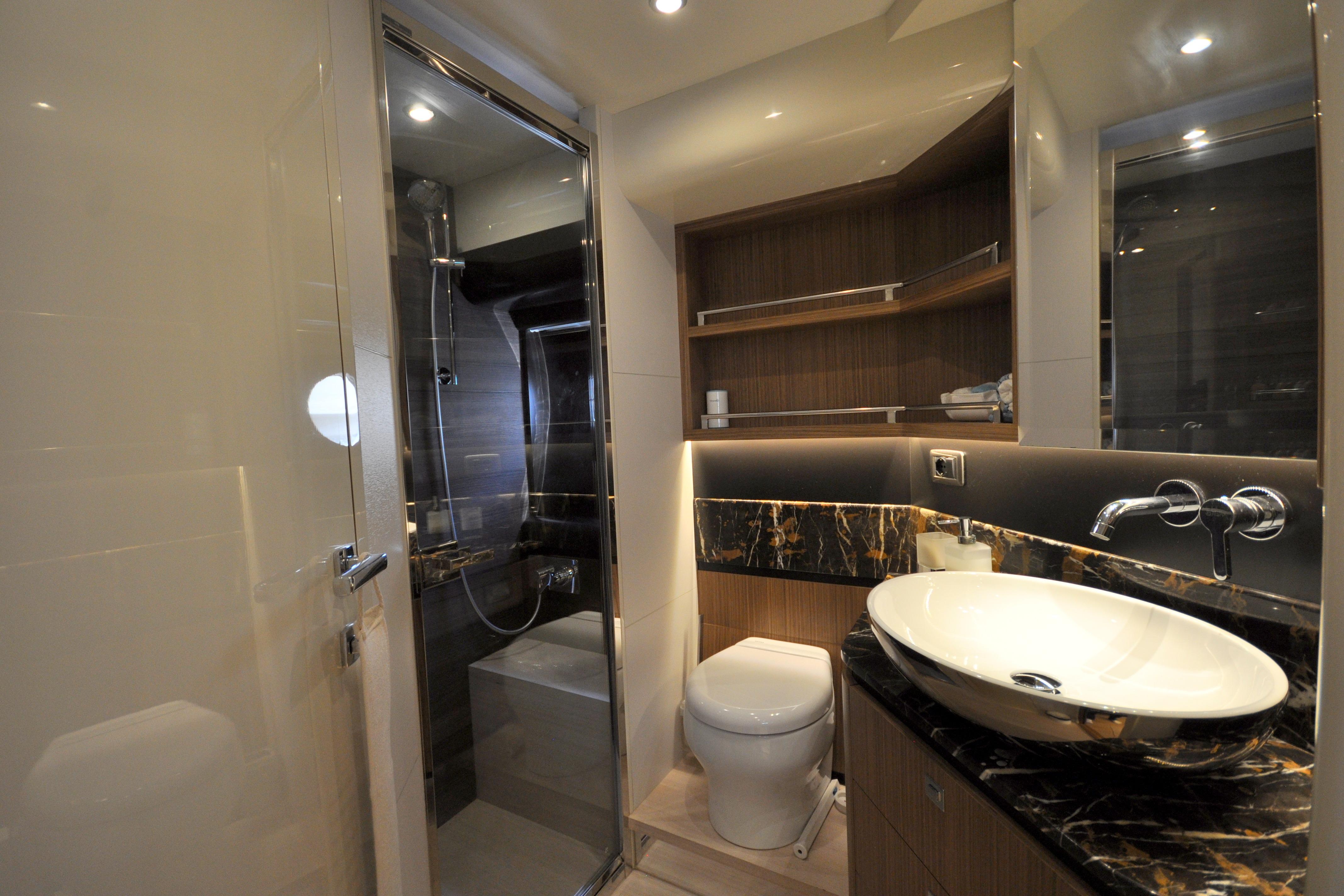 Luxurious bathroom on 2018 Absolute Navetta 52 yacht with modern fixtures and elegant design.